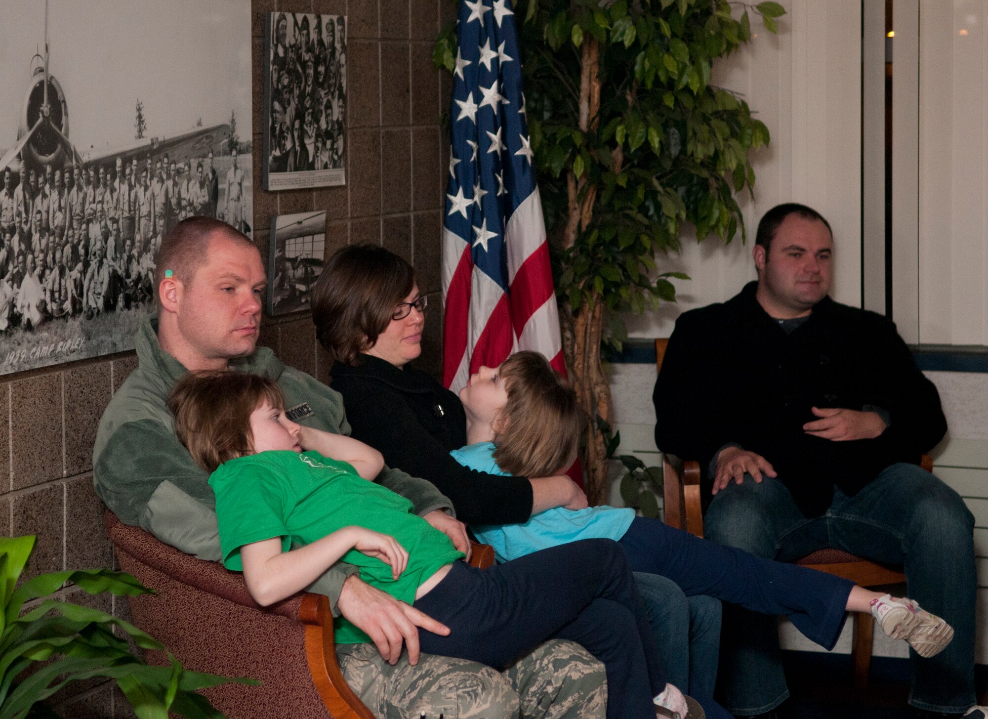 A Minnesota Air National Guard family spends a few moments together on March 7, 2012 just before the Airman boards his flight on a C-130 H3 “Hercules” and launches from the St. Paul Air National Guard base to Afghanistan in support of Operation Enduring Freedom. USAF official photo by Senior Airman Jonathan Young