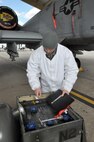 Airman Branden Jewell, 442nd Aircraft Maintenance Squadron/b-flight, inspects his equipment as he prepares to load liquid oxygen onto an A-10 Thunderbolt II on March 4, 2012. The 442nd AMXS is part of the 442nd Fighter Wing, an A-10 reserve unit at Whiteman Air Force Base, Missouri. (U.S.Air Force photo/Senior Airman Wesley Wright)