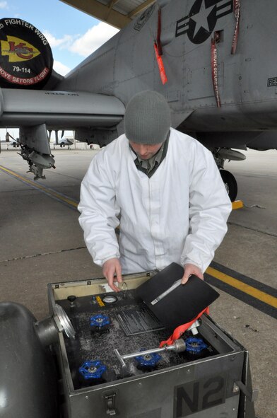 Airman Branden Jewell, 442nd Aircraft Maintenance Squadron/b-flight, inspects his equipment as he prepares to load liquid oxygen onto an A-10 Thunderbolt II on March 4, 2012. The 442nd AMXS is part of the 442nd Fighter Wing, an A-10 reserve unit at Whiteman Air Force Base, Missouri. (U.S.Air Force photo/Senior Airman Wesley Wright)