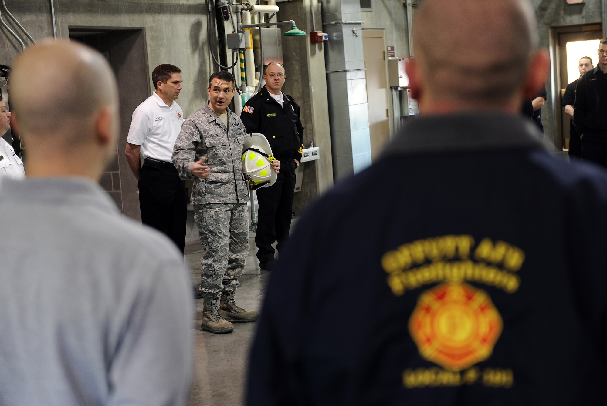 U.S. Air Force Brig. Gen. Donald Bacon, 55th Wing commander, addresses the fire fighters during their morning roll call following a 24-hour shift with them at the firehouse on Offutt Air Force Base,  Neb., March 8.  Bacon spent a 24-hour period with Offutt firefighters to get an up-close look into their operations and life in the firehouse.  (U.S. Air Force photo by Josh Plueger/Released).