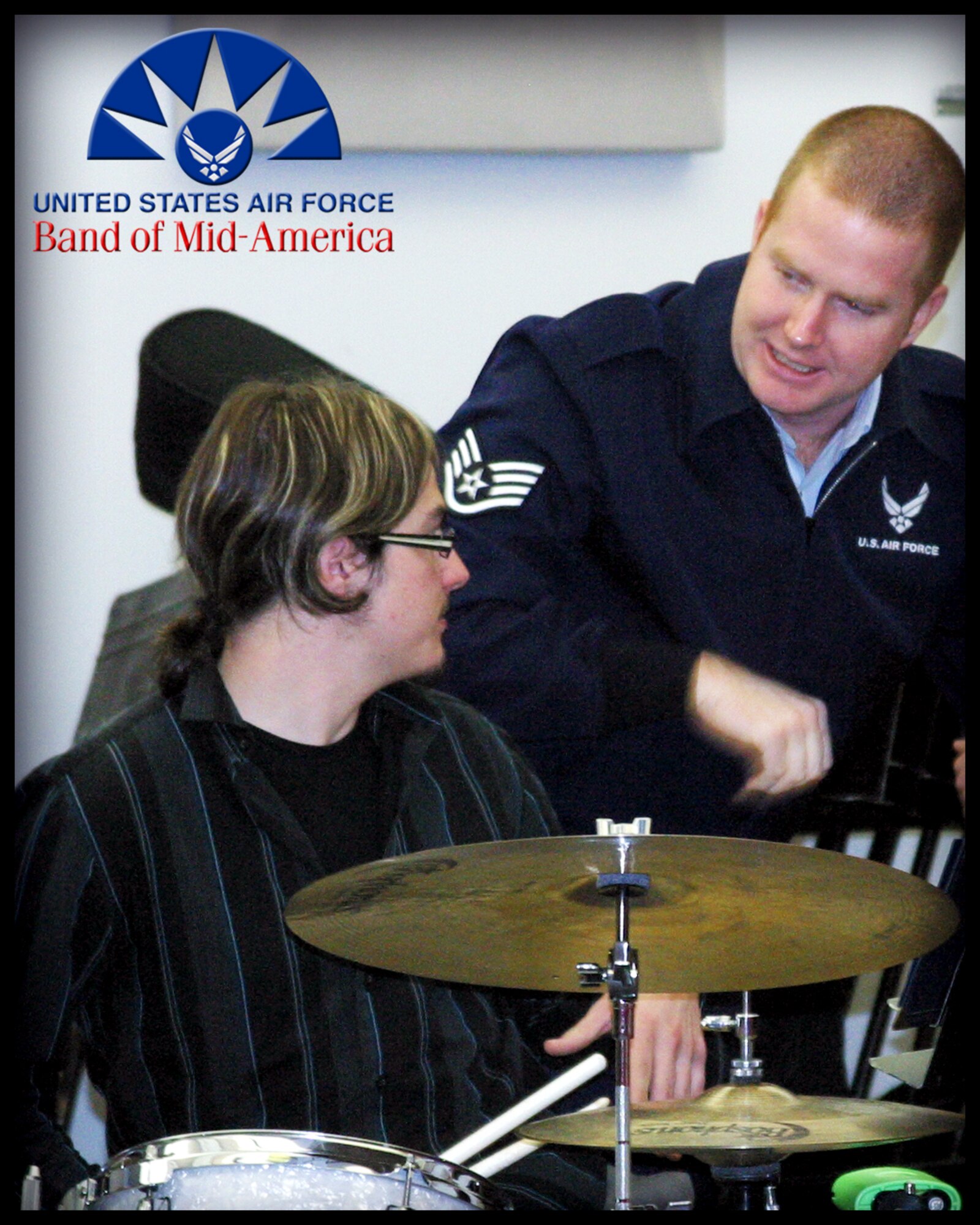Drummer and Percussionist SSgt Jody Walker works one-on-one with a student at a master class between the Band of Mid-America bandsmen and student musicians of the Murray State University Jazz Band on March 27, 2012.  In addition to active duty obligations, many bandsmen of the Air Force Regional Band program are certified teachers and professors who bring their off-duty abilities into uniform to fulfill the objectives of the AF Band Program.  By providing Master Classes and clinics to our regional community, the Band of Mid-America advances the professional reputation of the Air Force and enables students toward musical excellence in a fun and personable way. Featured from left to right: SSgt Drew Minns, A1C Mike Mitchell, MSgt Paul Shaw, A1C Andy Detra and A1C Chris Haughey (Photo courtesy/SrA Carmen Emborski)