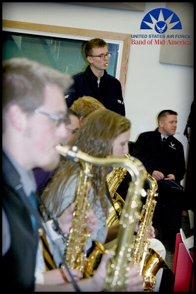 Engaging Air Force experience with prior education, saxophonist A1C Kristian Baarsvik and 1st Lt Dustin Doyle (seated) collect their thoughts before providing insight to students of the Murray State University Jazz Band on March 27, 2012.  By offering these master class opportunities to institutions of learning throughout the Midwest, bandsmen of the Band of Mid-America inspire youth towards musical excellence while fostering an appreciation of our Air Force. (Photo courtesy/SrA Carmen Emborski)