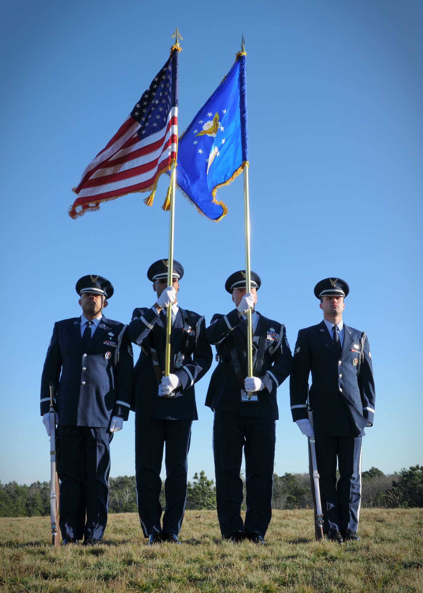 Members of the 102nd Honor Guard prepares to post the colors during a ceremony at the Bourne National Cemetery, Mass., Jan. 19. (National Guard photo by Tech. Sgt. Kerri Cole/Released)