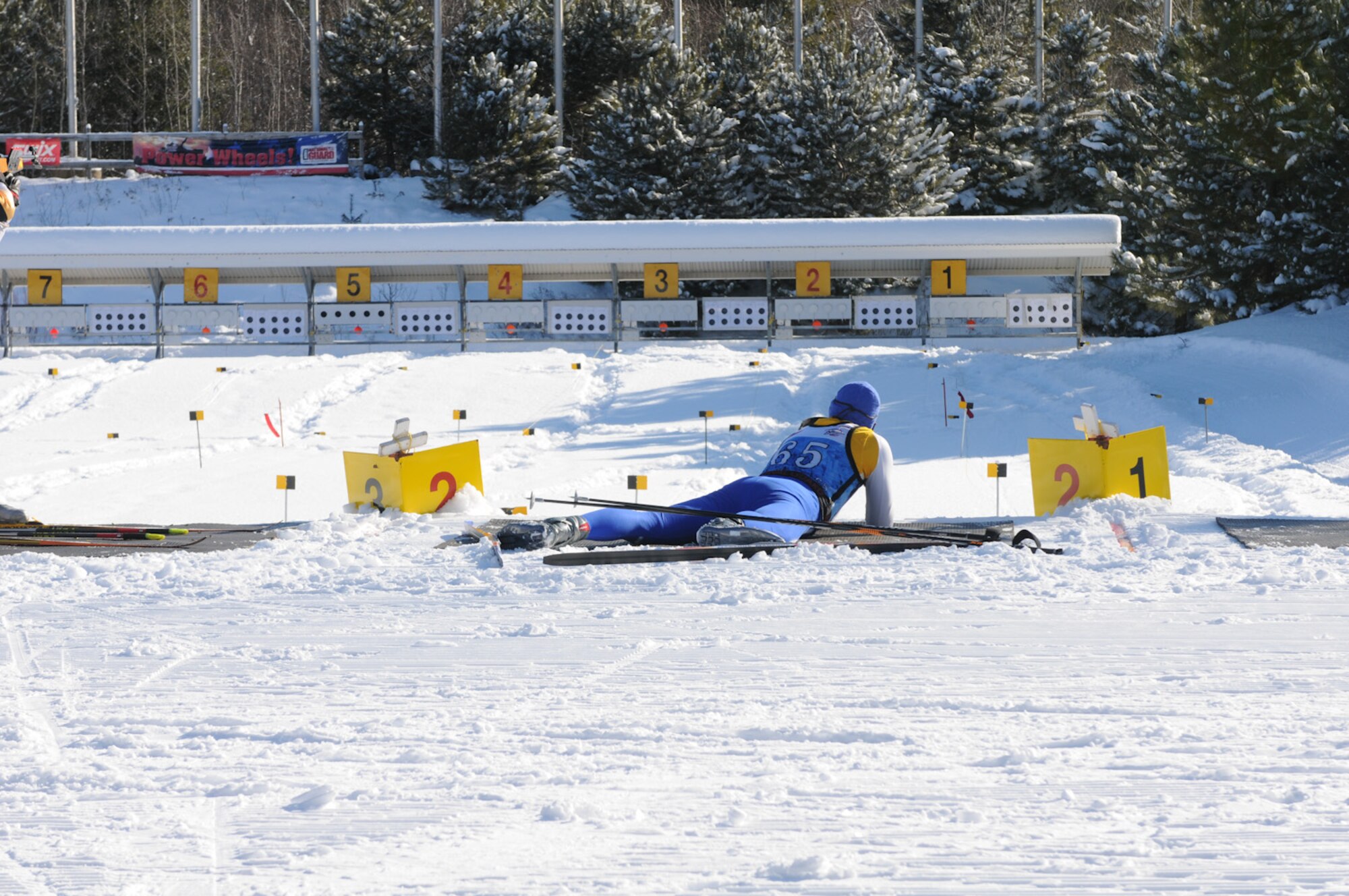 Senior Master Sgt. Jeffrey Soja of the 202nd Weather Flight, Otis Air National Guard Base, Mass., shoots a target in the prone position from 50 meters using a .22 caliber rifle. Three members of the Massachusetts National Guard Biathlon Team advanced enough during the season to gain a spot at the National Championships at the Camp Ethan Allen Training Site (CEATS) in Jericho, Vermont. (National Guard photo by Tech. Sgt. Kerri Cole/Released)
