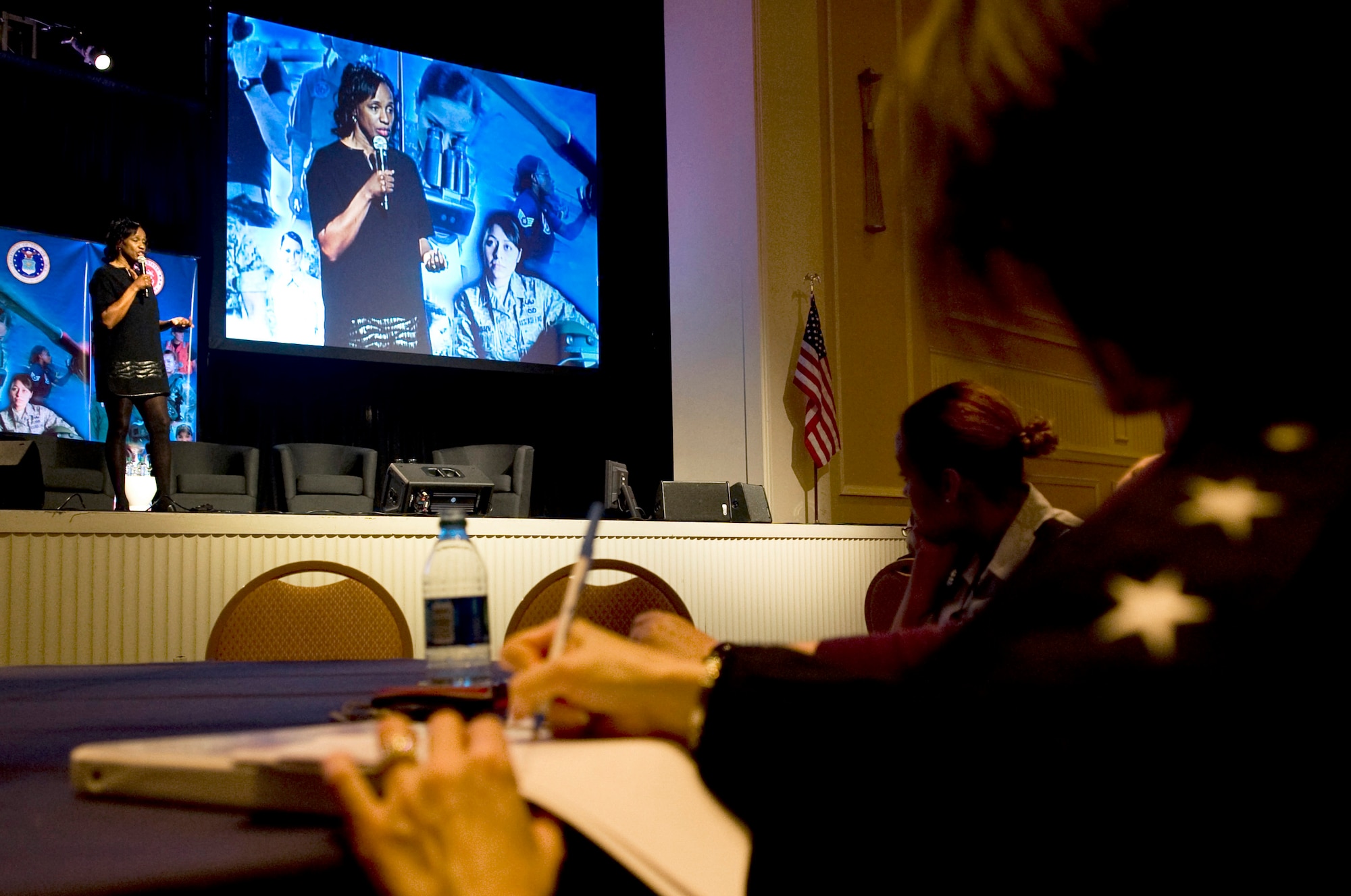 Maj. Gen. Sharon Dunbar takes notes as Jackie Joyner-Kersee, one of the most decorated female athletes of all-time, speaks of strength and courage during the Joint Women's Leadership Symposium Mar. 5, 2012, at the National Harbor in Washington, D.C. This event offered more than 1,700 women from all Service branches the opportunity to focus on professional and leadership development. (U.S. Air Force photo by Master Sgt. Jeanette Spain)