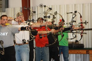U.S. Army Sgt. Justin Steele (second from left) recently returned to Fort Eustis, Va. from Sumter, S.C., where he participated in an archery qualifier for the upcoming 2012 Warrior Games. Warrior Games is an annual competition for wounded, ill, and injured servicemembers. The event will be held April 30 through May 5 in Colorado Springs, Colo. (Courtesy photo by Nick McCormac/Released)