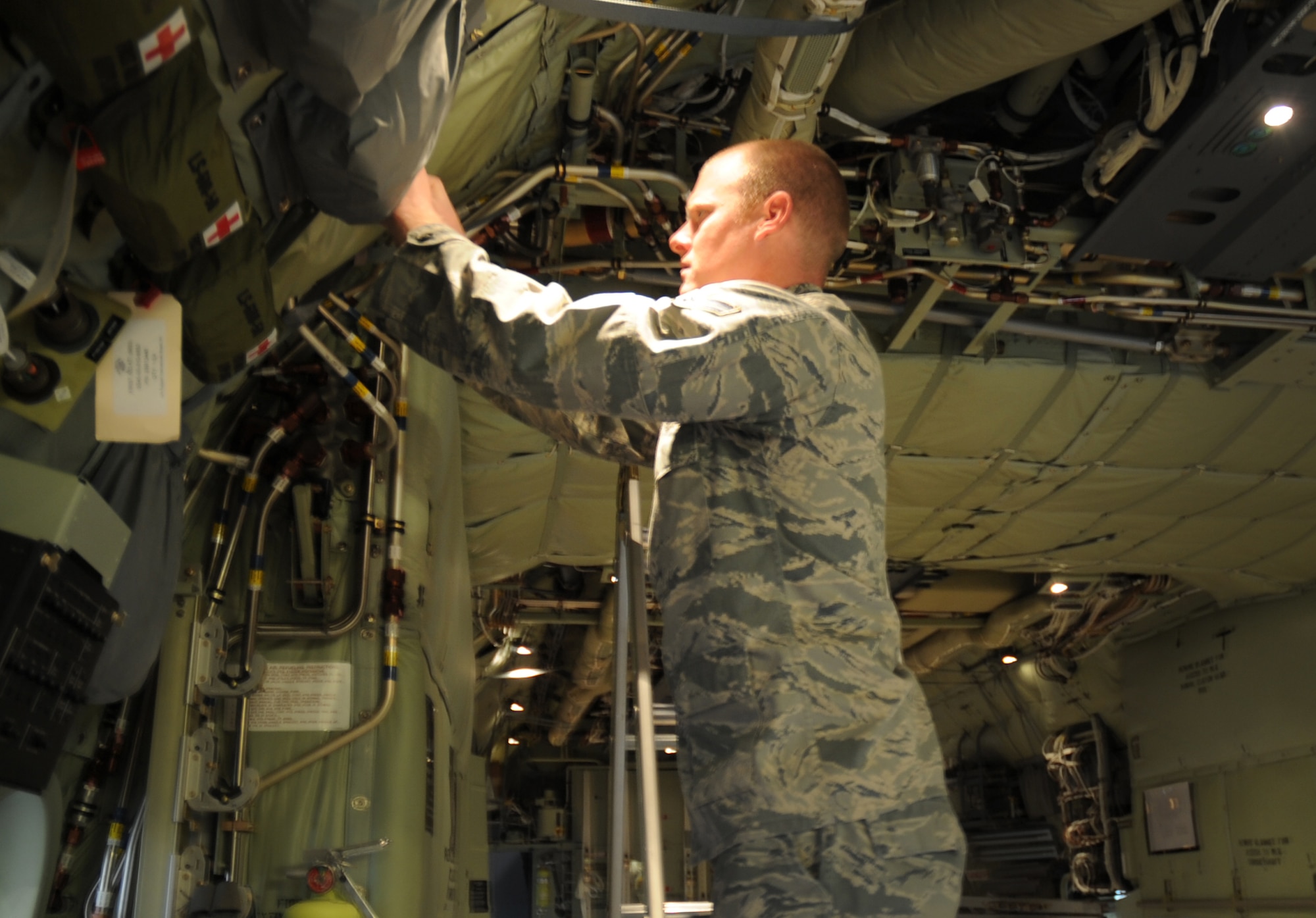U.S. Air Force Airman 1st Class Danny Beckwith, 522nd Special Operations Squadron crew chief, inspects electrical components on the MC-130J Commando II at Cannon Air Force Base, N.M., March 7, 2012. Crew chiefs must ensure aircraft configurations meet Air Force Special Operations Command standards before they are cleared for flight. (U.S. Air Force photo by Airman 1st Class Alexxis Pons Abascal) 