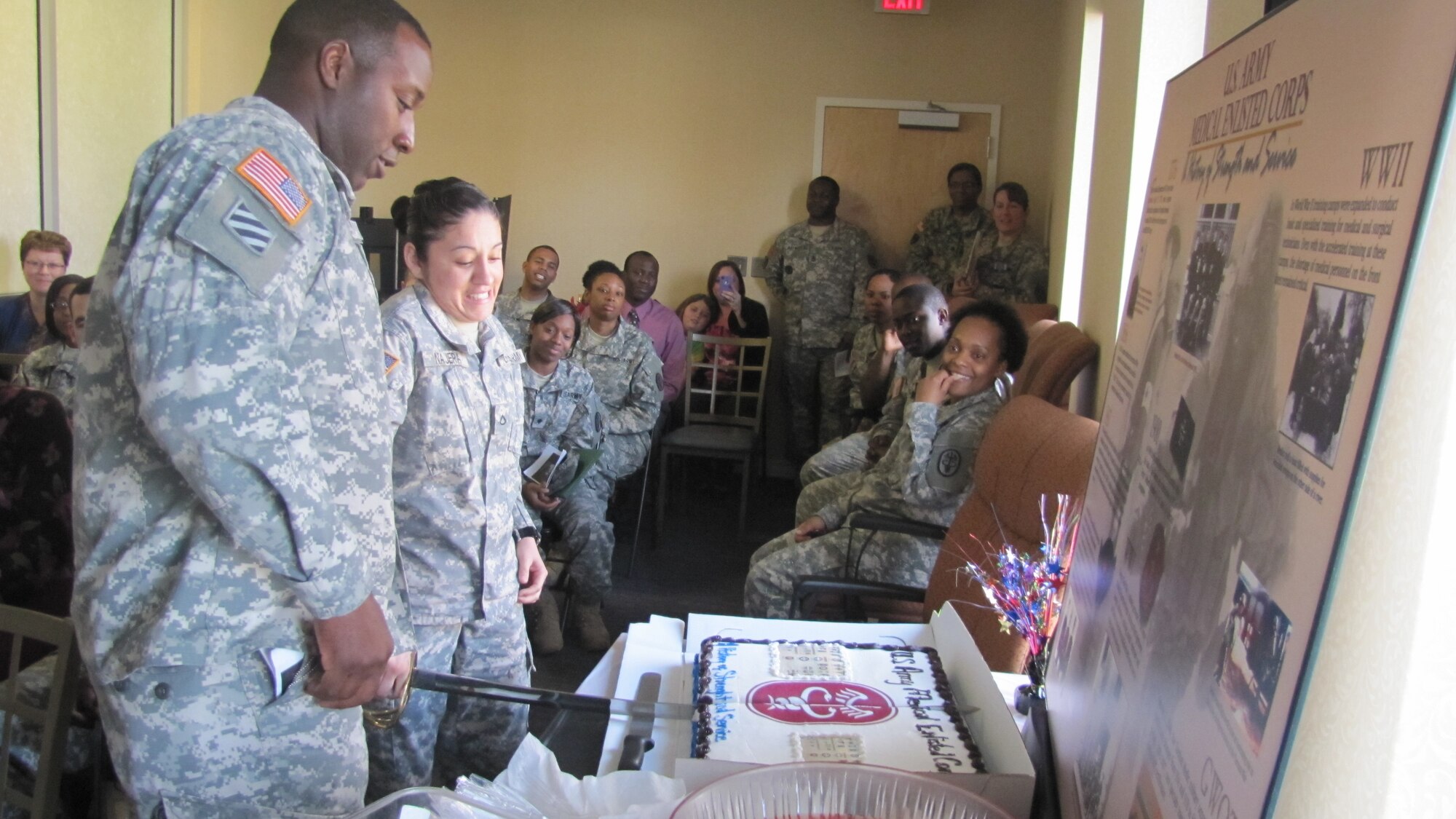 During the 125th anniversary of the Medical Enlisted Corps at Fort Eustis, Va., Mar. 1, 1st Sgt. Damon T. Clark and Pfc. Gloria M. Najera were honored as the youngest and oldest Soldier present.  They are both assigned to the Medical Company of McDonald Army Health Center.  Clark is the company first sergeant, and Najera is an operating room technician. (U.S. Army photo by Marlon Martin/Released)