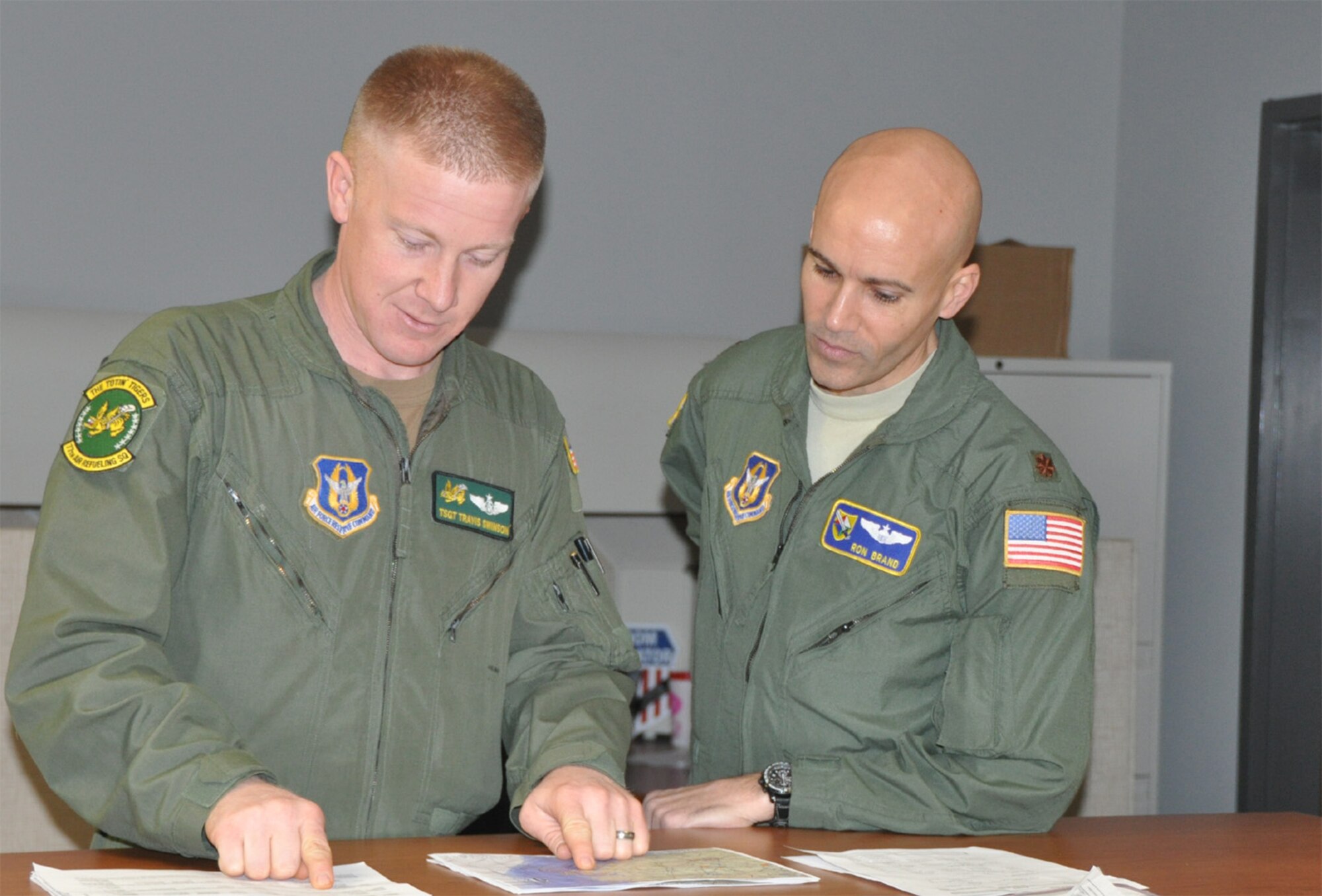 Tech. Sgt. Travis Swinson (left) goes over a flight plan with Capt. Ron Brand. Swinson was named the 916th ARW's Outstanding Non-Commissioned Officer of the Year for 2011.