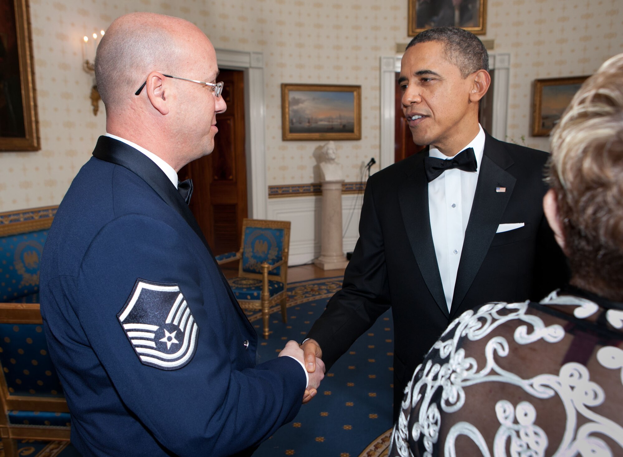 WASHINGTON, D.C. -- President Barack Obama shakes hands with Master Sgt. Shane Lacaillade, 509th Medical Operations Squadron clinical operations NCO in charge, during a White House tribute to Iraq War veterans and their families Feb. 29 to honor them for their service, sacrifice and commitment to the nation. Lacaillade was nominated by his squadron to attend the event and was selected based on his accomplishments while deployed to Iraq. (Official White House courtesy photo/Lawrence Jackson) 