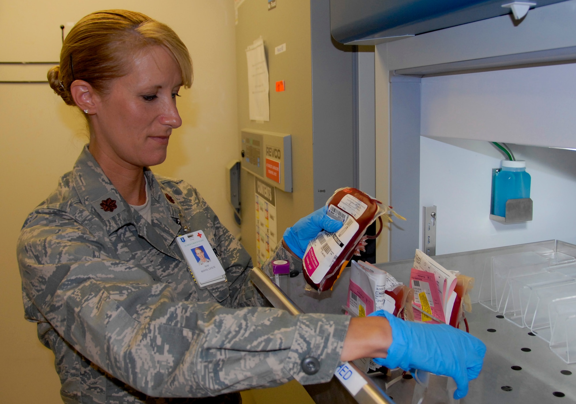 Maj. Raynae Leslie, the 96th Medical Support Squadron’s chief of clinical laboratory services at Eglin AFB’s hospital, pulls a unit of blood from the cross-matched shelf for issue for a transfusion.  Leslie and her team provided more than 400 pints of blood to a U.S. Army Ranger, helping save his life during her 2011 deployment.  (U.S. Air Force photo/Kevin Gaddie)