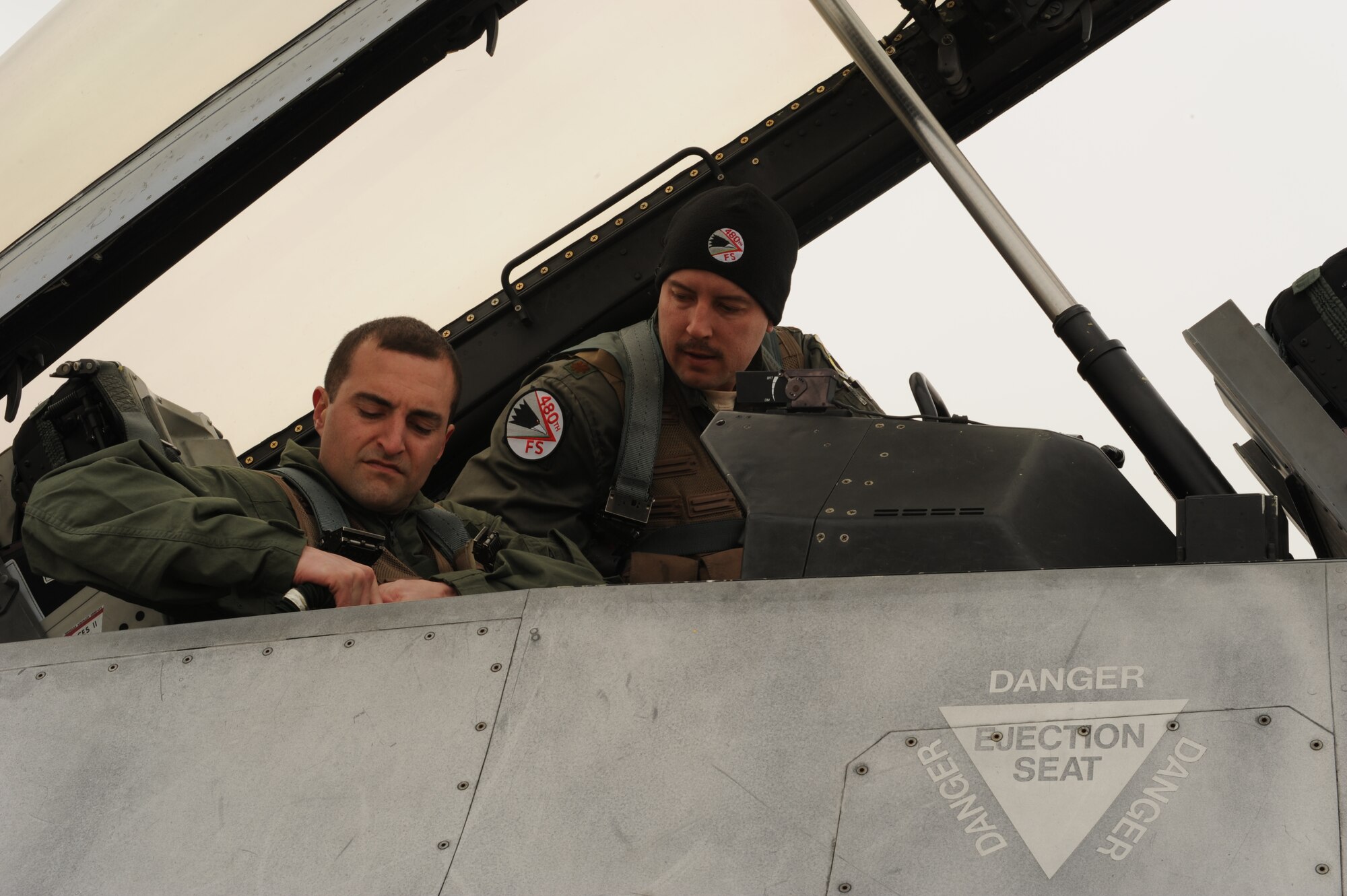 KONYA, Turkey – Maj. Kevin Fisher, 480th Fighter Squadron pilot, helps Staff Sgt. Charles Morris, 52nd Aircraft Maintenance Squadron strap in to an F-16 Fighting Falcon before an orientation flight during Anatolian Falcon 2012. The program gives support Airmen a unique opportunity to experience a pilot’s perspective on how the equipment they maintain functions during flight. (U.S. Air Force photo/Staff Sgt. Benjamin Wilson)