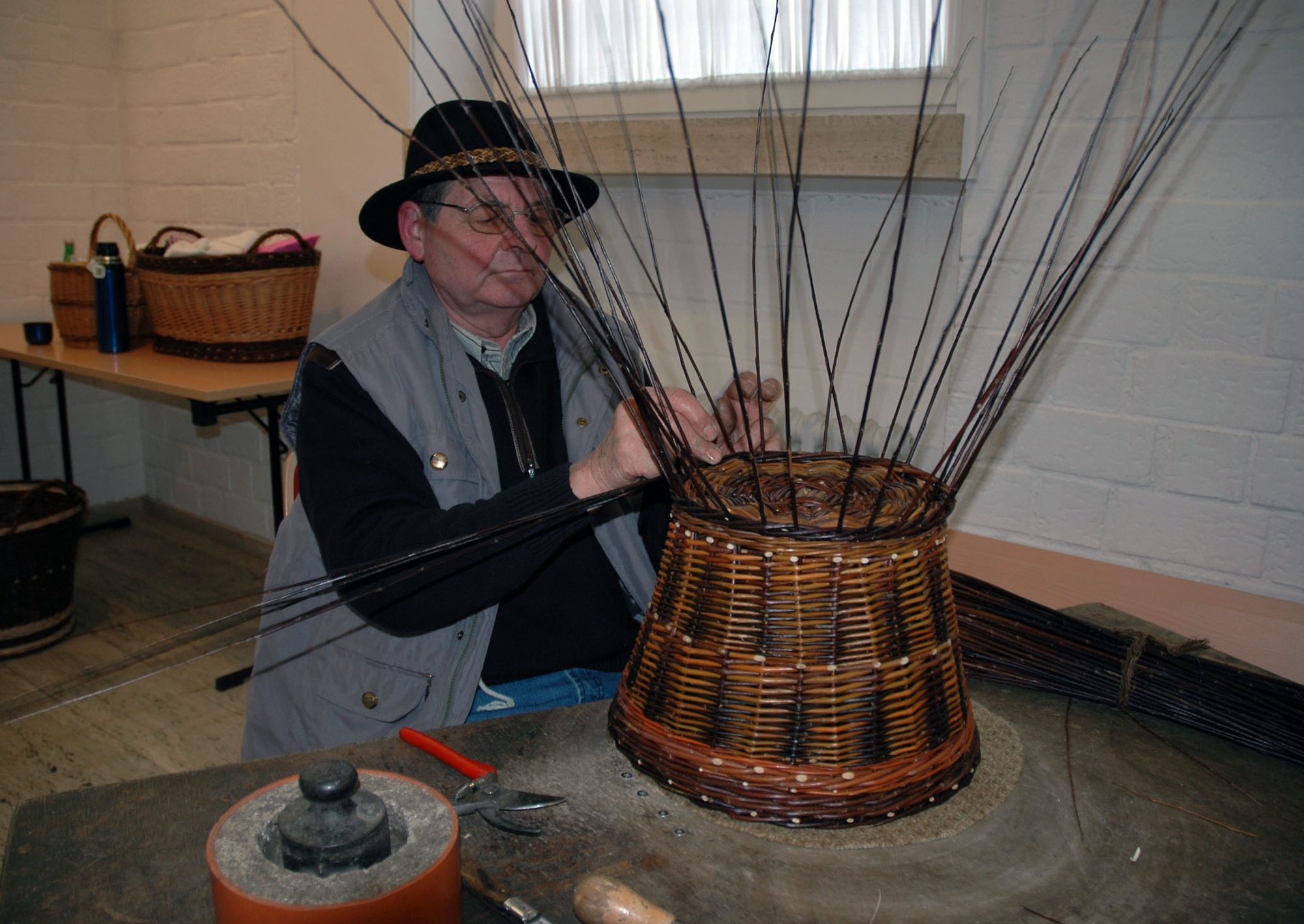 SPANGDAHLEM AIR BASE, Germany — A man weaves a basket using techniques from decades ago, which are still used by a few local craftsmen throughout the Eifel today, during a Beda Market in 2009. Local trades and businesses will be available at the market presenting their products reaching from traditional food products and handicrafts to classic vehicles and high technical farm equipment. For the first time, a special wellness fair will be incorporated into the many displays and events. This year’s market will take place March 16-18. Stores will open from 1-6 p.m. March 18, which is a Sunday. (U.S. Air Force photo/Iris Reiff/Released)