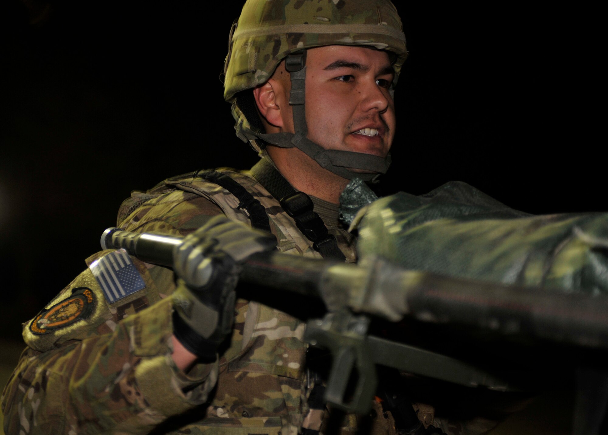 BAGRAM AIRFIELD, Afghanistan— Senior Airman Jonathan Bussard helps carry a litter as part of the Combined Joint Task Force-One/Regional Command( East) Warrior Team Competition at Bagram Airfield, Afghanistan, March 10, 2012. Bussard is a member of the 455th Expeditionary Security Forces Squadron and is deployed from Offut Air Force Base, Neb. He was part of the only Air Force team to compete in the competition. (U.S. Air Force photo/ Airman 1st Class Ericka Engblom)