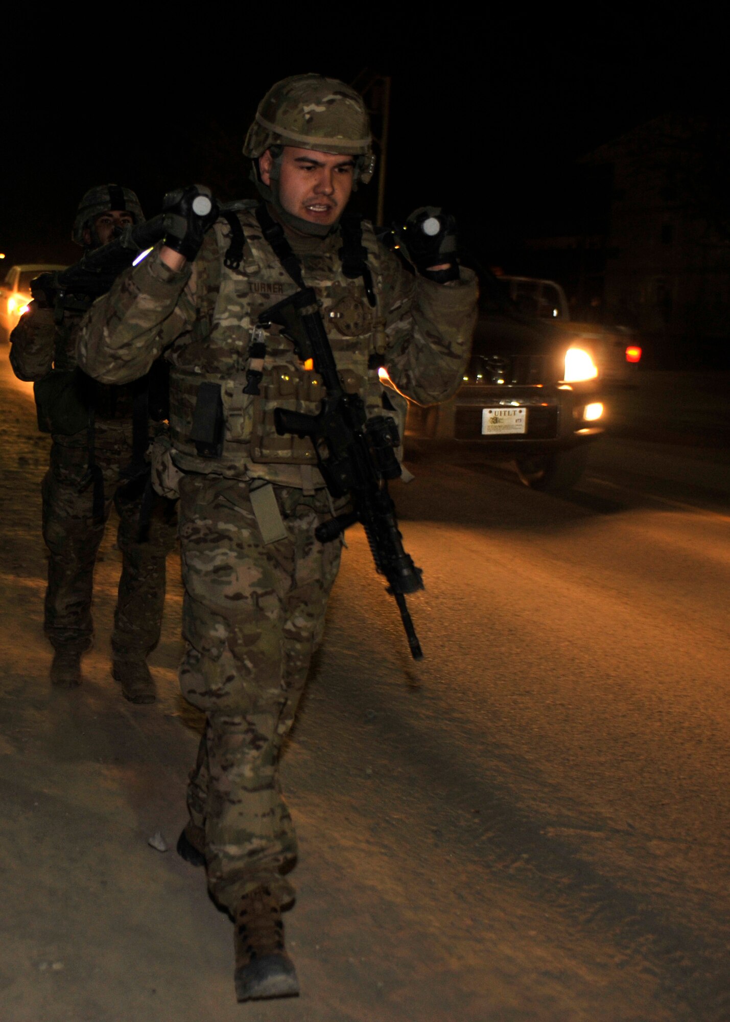 BAGRAM AIRFIELD, Afghanistan— Senior Airman Curtis Turner and Senior Airman Jonathan Bussard carry a litter down Disney Boulevard at Bagram Airfield, Afghanistan, March 10, 2012. Turner and Bussard are members of the 455th Expeditionary Security Forces Squadron and are deployed from Offut Air Force Base, Neb. They were the only Airmen to compete in the Combined Joint Task Force-One/Regional Command( East) Warrior Team Competition, a contest designed to test a warrior’s aptitude and battle skills. (U.S. Air Force photo/Airman 1st Class Ericka Engblom)