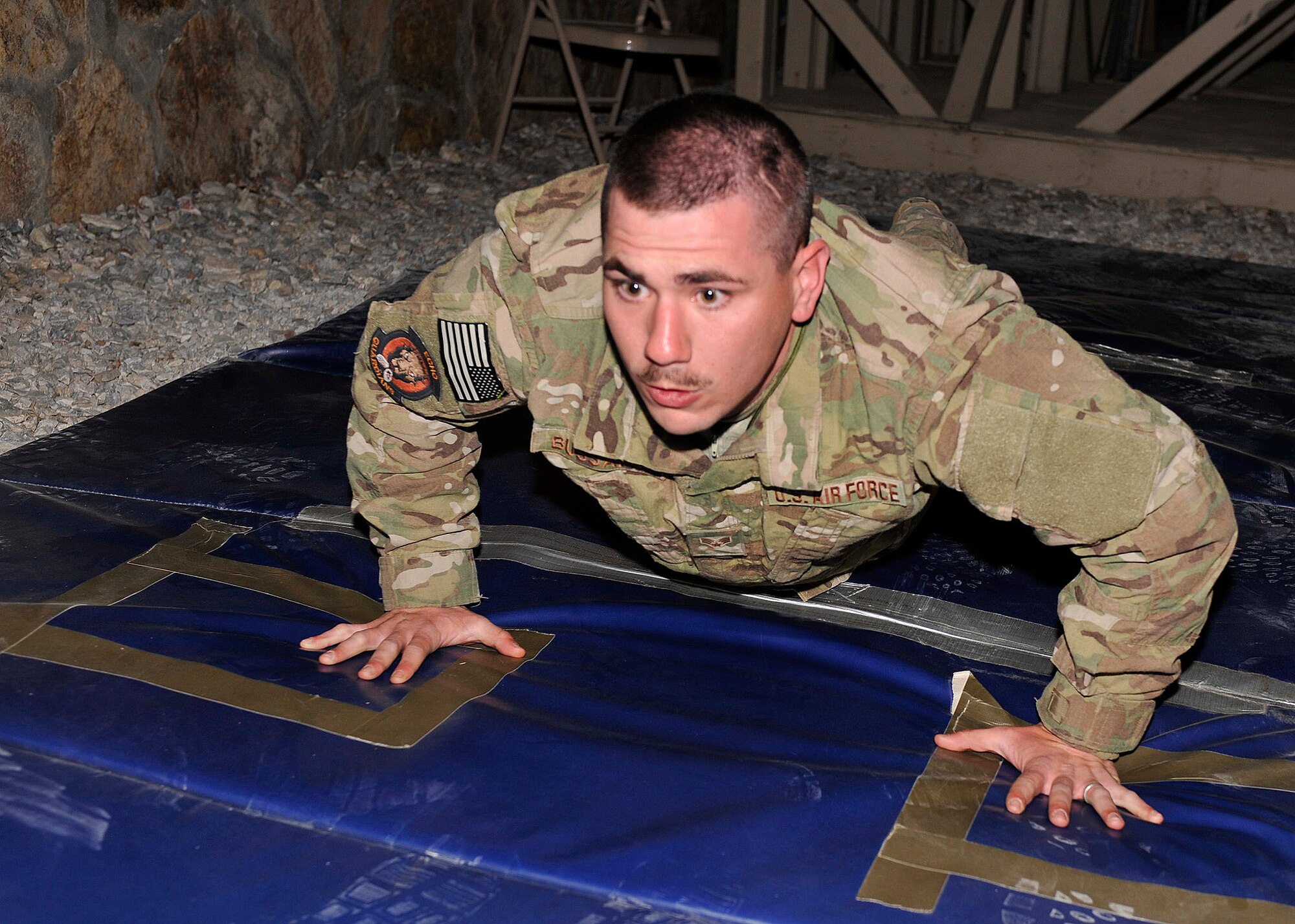 BAGRAM AIRFIELD, Afghanistan—Senior Airman Curtis Turner completes a series of pushups as part of the Combined Joint Task Force-One/Regional Command( East) Warrior Team Competition at Bagram Airfield, Afghanistan, March 10, 2012. Turner is a member of the 455th Expeditionary Security Forces Squadron and is deployed from Offut Air Force Base, Neb. He was part of the only Air Force team in the competition. (U.S. Air Force photo/Airman 1st Class Ericka Engblom)