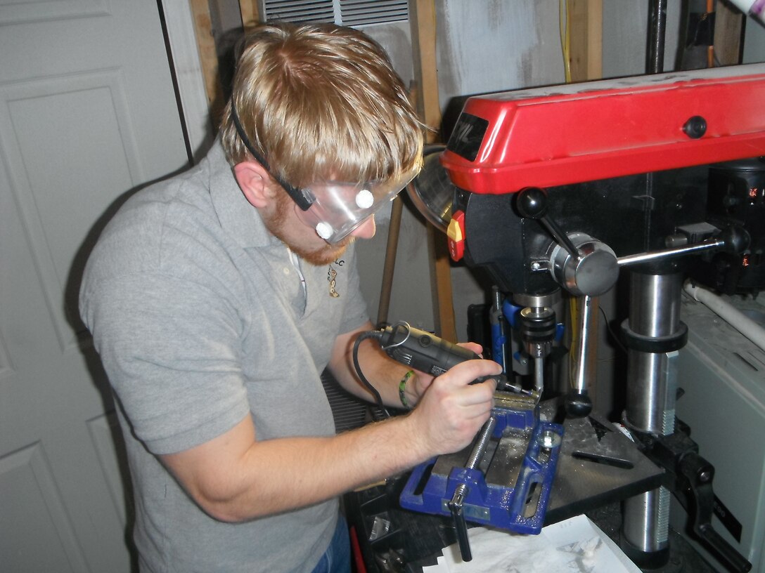 WINCHESTER, Va. — Joey Behr, a civil engineer intern at the U.S. Army Corps of Engineers Middle East District, prepares one of his handmade broad-head arrow tips. 