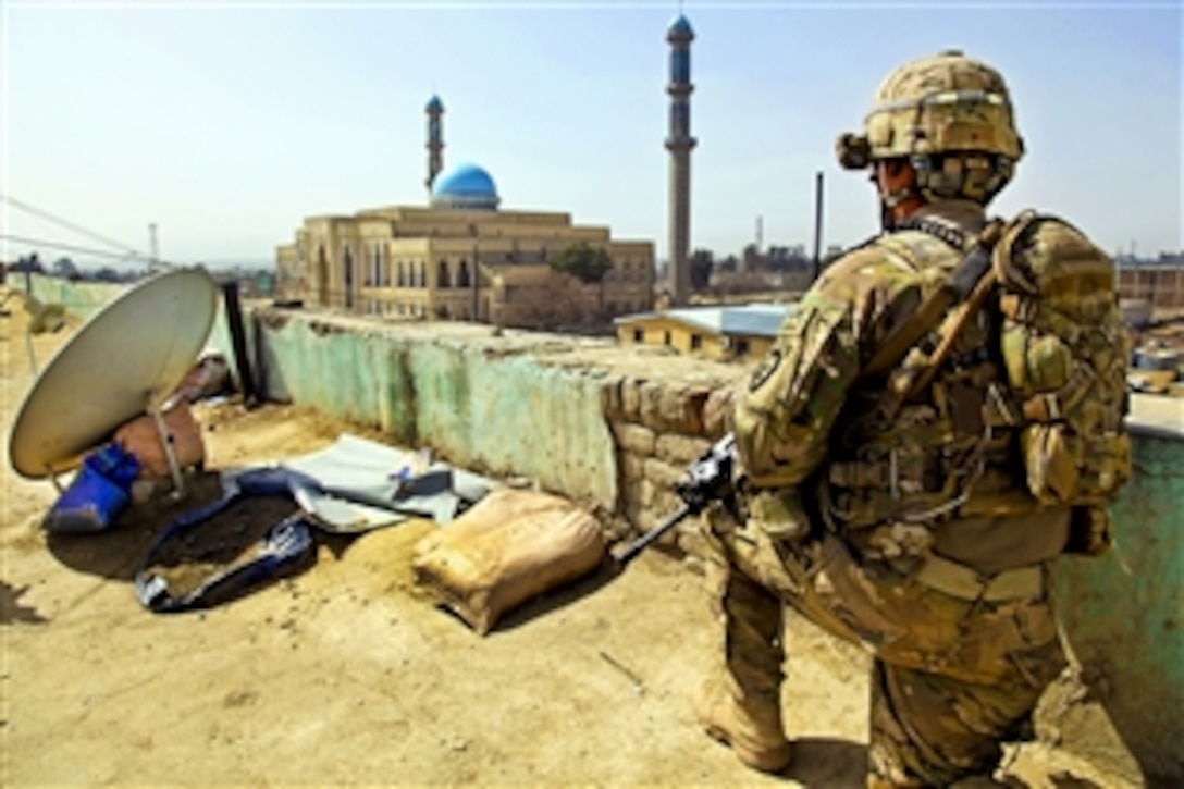 U.S. Army Staff Sgt. Christian Aleman provides security on the Khowst Prevention Headquarters in Khowst City in Afghanistan's Khowst province, March 5, 2012. Aleman is assigned to 2nd Battalion, 377th Parachute Field Artillery Regiment. Coalition forces talk weekly about ways to work better and increase support of one another for the security of the province's residents.