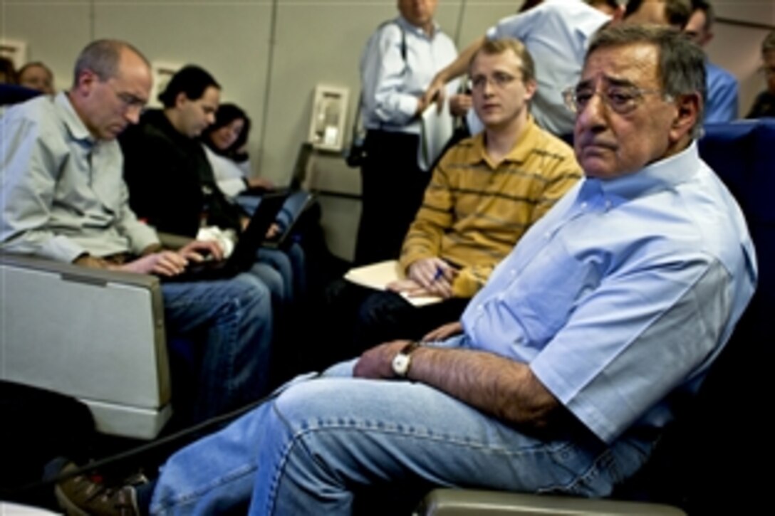 U.S. Defense Secretary Leon E. Panetta answers questions during a press availability onboard an Air Force E-4B National Airborne Operations Center en route to Bishkek, Kyrgyzstan, March 12, 2012.