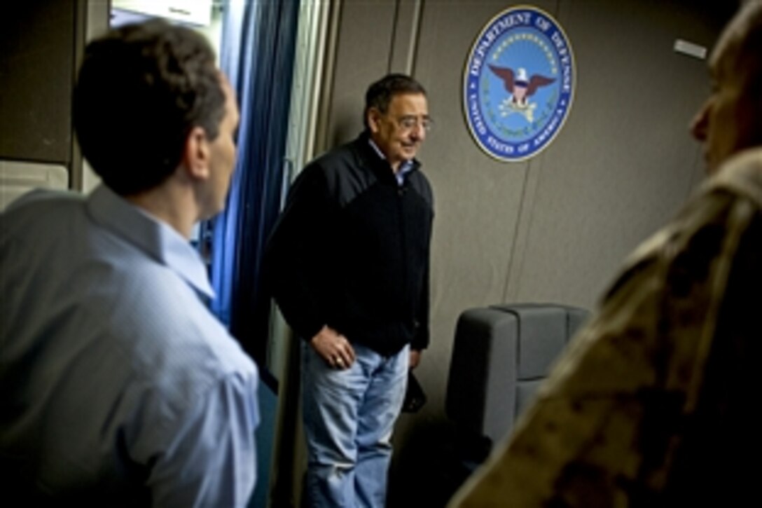 U.S. Defense Secretary Leon E. Panetta gets a briefing from Jeremy B. Bash, left, chief of staff, and Marine Corps Lt. Gen. John F. Kelly, senior military assistant, on the developing situation in Afghanistan on a Air Force E-4B National Airborne Operations Center en route to Bishkek, Kyrgyzstan, March 12, 2012.