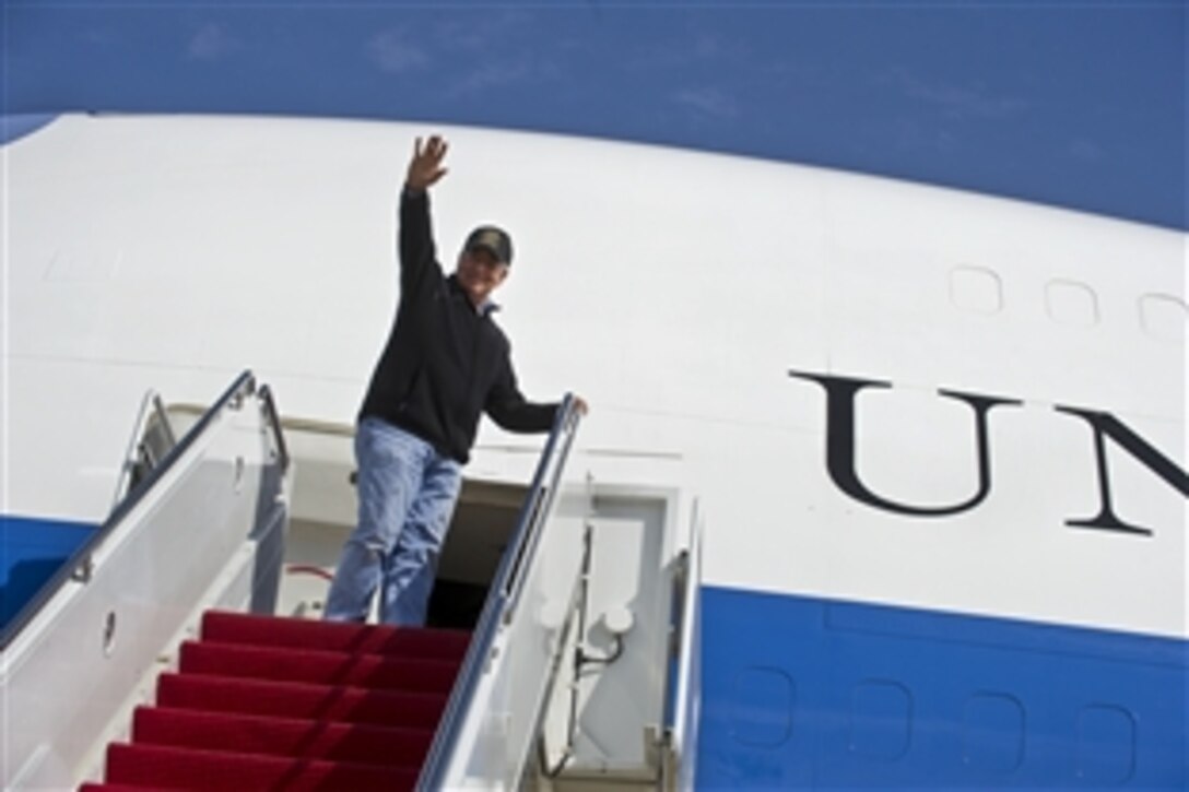 U.S. Defense Secretary Leon E. Panetta waves before boarding an Air Force E-4B National Airborne Operations Center on Joint Base Andrews Naval Air Facility Washington, Md., March 12, 2012, en route to Bishkek, Kyrgyzstan, for counterpart and troops visits in the country.