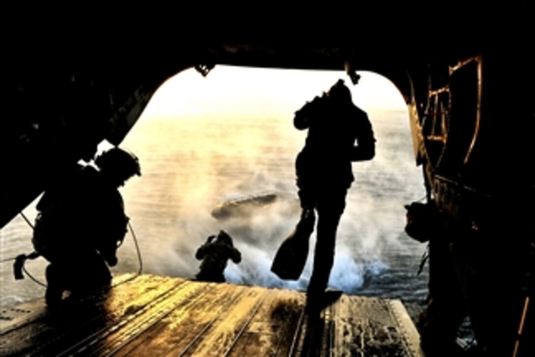 Members of Air Force Special Operations weather teams participate in a training scenario on a CH-47 Chinook during Emerald Warrior at Hurlburt Field, Fla., on March 7, 2012.  The primary purpose of Emerald Warrior is to exercise special operations components in urban and irregular warfare settings to support combatant commanders in theater campaigns.  
