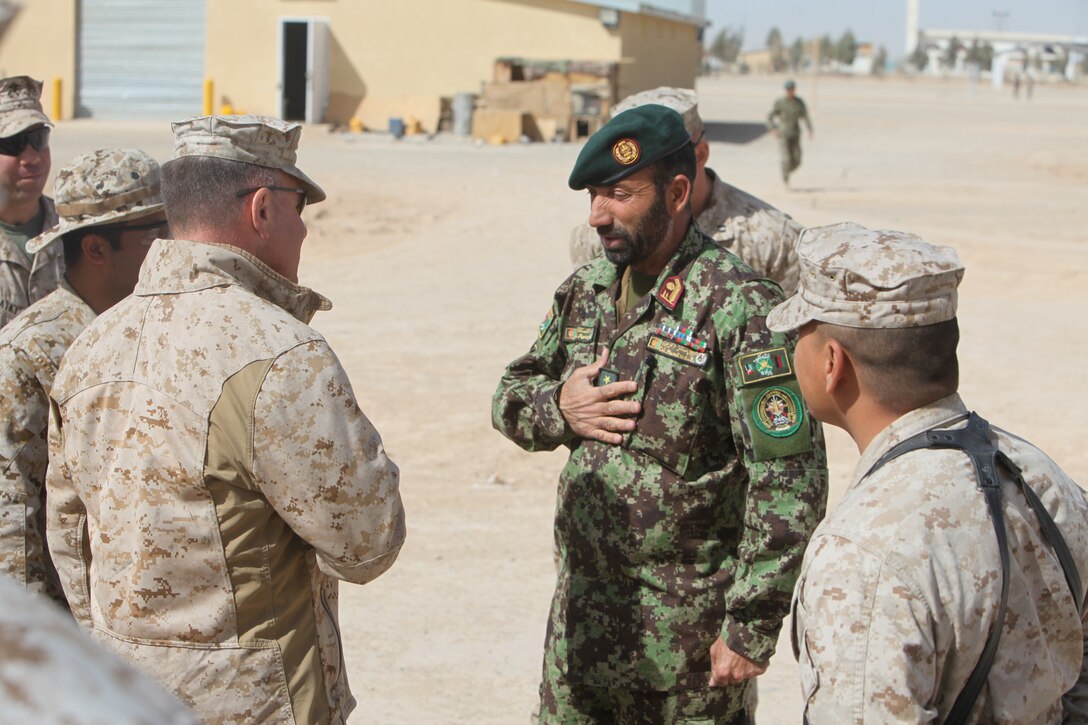 Brig. Gen. John J. Broadmeadow (Left), commanding general of 1st Marine Logistics Group (Forward), meets Col. Karimi Mumtaz, commanding officer of Regional Logistics Support Command-Southwest during a tour of Camp Shorabak by the commanding general and staff of 1st MLG (Fwd). The tour provided an opportunity for logistics Marines to share experiences with their Afghan counterparts and learn how they could help each other succeed.