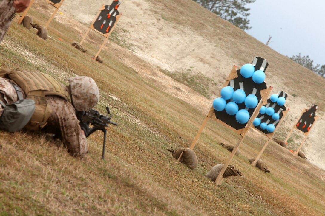 A Marine with 2nd Maintenance Battalion, 2nd Marine Logistics Group represents his squad during the marksmanship portion of the super squad competition aboard Camp Lejeune, N.C., March 13, 2012. The first squad to hit all of their targets got a head-start on the next leg of the course. (U.S. Marine Corps photo by Cpl. Katherine M. Solano)