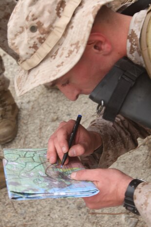 Sgt. Nicholas Safran, the squad leader for general support maintenance, 2nd Maintenance Battalion, 2nd Marine Logistics Group, plots coordinates during a competition aboard Camp Lejeune, N.C., March 13, 2012. Safran led his Marines through the course covering combat and basic Marine Corps skills, including hiking and weapons assembly.  (U.S. Marine Corps photo by Cpl. Katherine M. Solano)