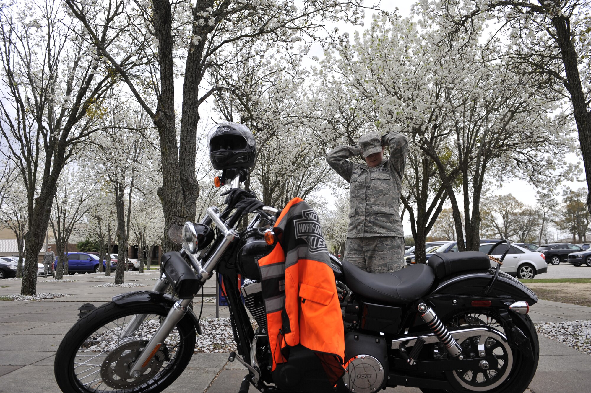 SHAW AFB - U.S. Air Force Staff Sgt. Cassandra Jenniges, a native of Lamberton, Minn., and currently assigned to the 20th Finance Squadron, 20th Fighter Wing, Shaw Air Force Base, S.C. prepares to don her protective equipment before riding her motorcycle on March 9, 2012, while at Shaw AFB, S.C.  (U.S.  Air Force photo by Airman 1st Class Ashley L. Gardner/Released)