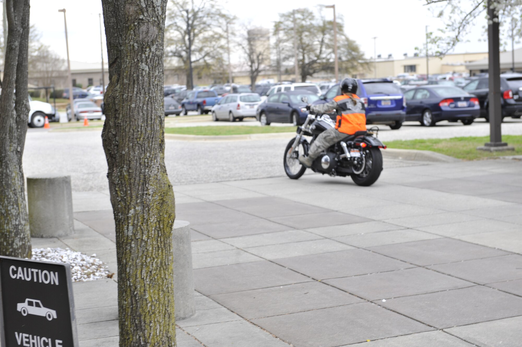 SHAW AIR FORCE BASE S.C. - U.S. Air Force Staff Sgt. Cassandra Jenniges, a native of Lamberton, Minn., and currently assigned to the 20th Force Support Squadron, Shaw Air Force Base, S.C. departs her office parking lot on her motorcycle on March 9, 2012.  (U.S.  Air Force photo/Master Sgt. Cohen A. Young/Released)