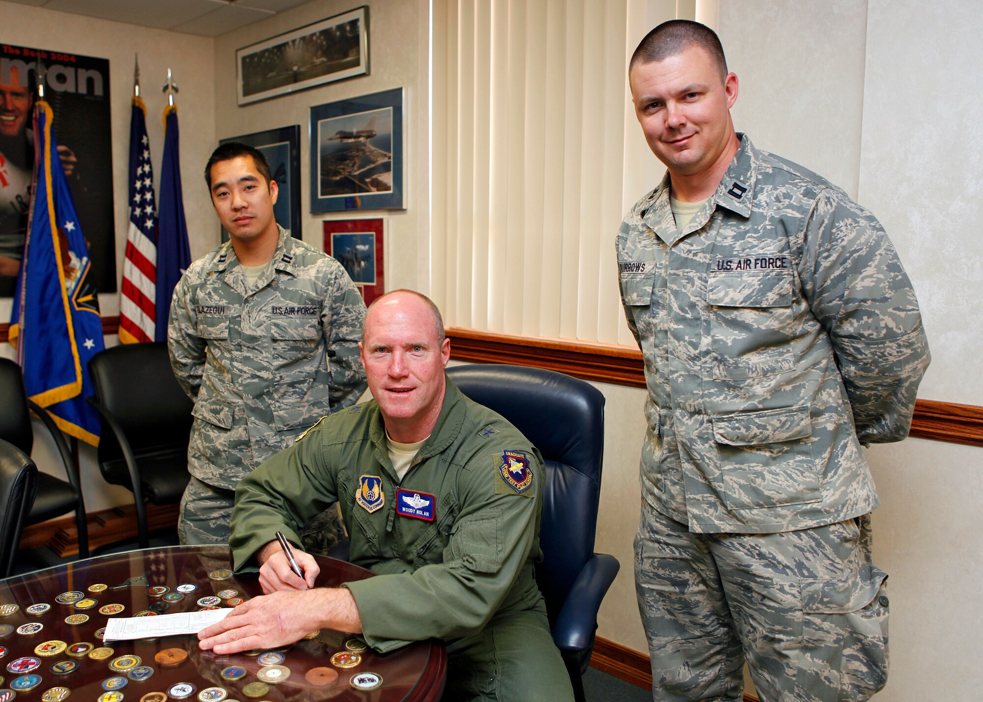 Brig. Gen. Robert C. Nolan II, Air Force Flight Test Center commander, prepares to fill out the Payroll Deduction form to contribute to the Air Force Assistance Fund March 6. Edwards Air Force Base kicked off the annual AFAF campaign March 5. The last day to contribute to AFAF campaign will be April 13, 2012. (U.S. Air Force photo by Jet Fabara) 
