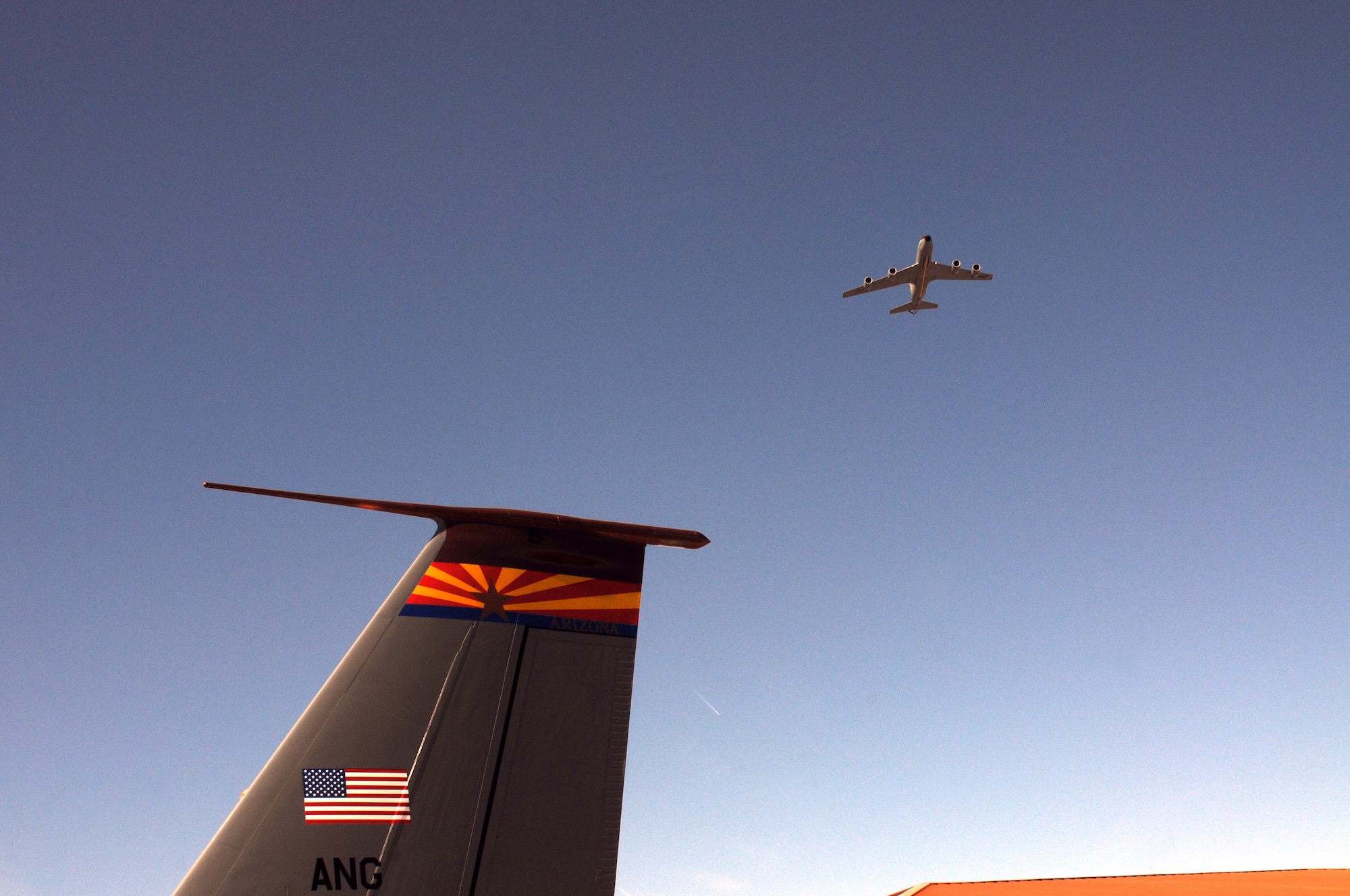 A KC-135 Stratotanker completed a fly-over during a memorial ceremony dedicating a KC-135 Stratotanker tail and plaque March 13, 2012, at the 161st Air Refueling Wing, Phoenix. The memorial ceremony marked the 30th anniversary when four 161st Air Refueling Group servicemembers lost their lives while on-duty. (Photo by Staff Sgt. Michael Matkin/Released)