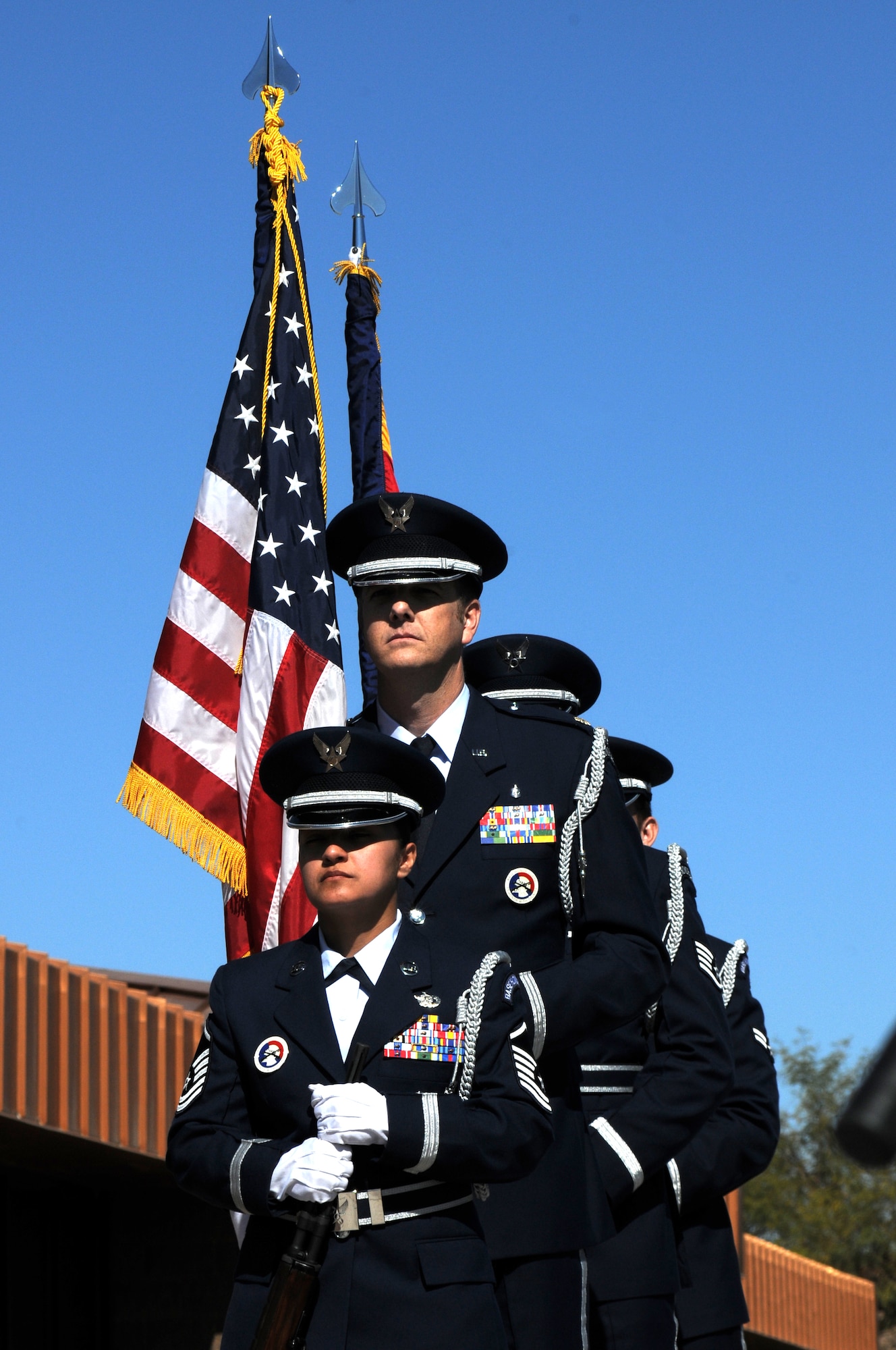 161st Air Refueling Wing honor guard bring in the colors during a memorial ceremony dedicating a KC-135 Stratotanker tail and plaque March 13, 2012, at the 161st Air Refueling Wing, Phoenix. The memorial ceremony marked the 30th anniversary when four 161st Air Refueling Group servicemembers lost their lives while on-duty. (Photo by Staff Sgt. Michael Matkin/Released)