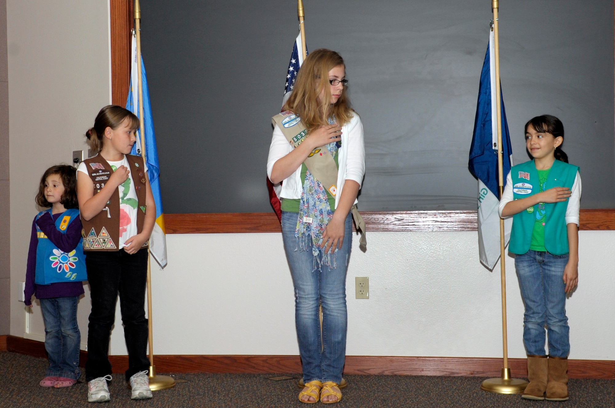 VANDENBERG AIR FORCE BASE, Calif. -- Vandenberg Space and Sea Girl Scouts post the colors during a ceremony celebrating the 100th Anniversary of the Girl Scouts here, Monday, March 12, 2012. Juliette "Daisy" Gordon Low founded the Girl Scouts March 12, 1912 and believed that all girls should be given the opportunity to develop physically, mentally, and spiritually. (U.S. Air Force photo/Jerry E. Clemens Jr.)