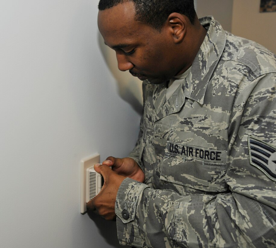 Staff Sgt. Richard Gooden, 11th Civil Engineer Squadron heating, ventilation, air conditioning and refrigeration (HVACR) craftsman, responds to a work order within the 11th Wing Public Affairs Office on March 13. 11 CES standard operating procedures ensure all HVACR work orders are completed immediately – with a normal response time of only a few hours.  Additionally, Gooden’s haste in fixing the 11WG/PA office’s air conditioning system rescued those within the office from what was affectionately becoming known as “Elmendorf-esque” temperatures. (U.S. Air Force photo/Airman 1st Class Lindsey A. Beadle)
