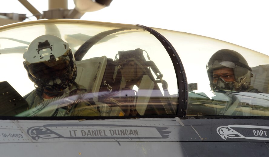 U.S. Air Force Col. Charlie Moore, 20th Fighter Wing commander, and Chief Master Sgt. Lefford Fate, 20th Fighter Wing command chief, prepare to fly a final flight at Shaw Air Force Base, S.C. on March 9, 2012. Col. Moore will be having his change of command ceremony on March 19, 2012.   (U.S. Air Force photo by Senior Airman Tabatha McCarthy/released)