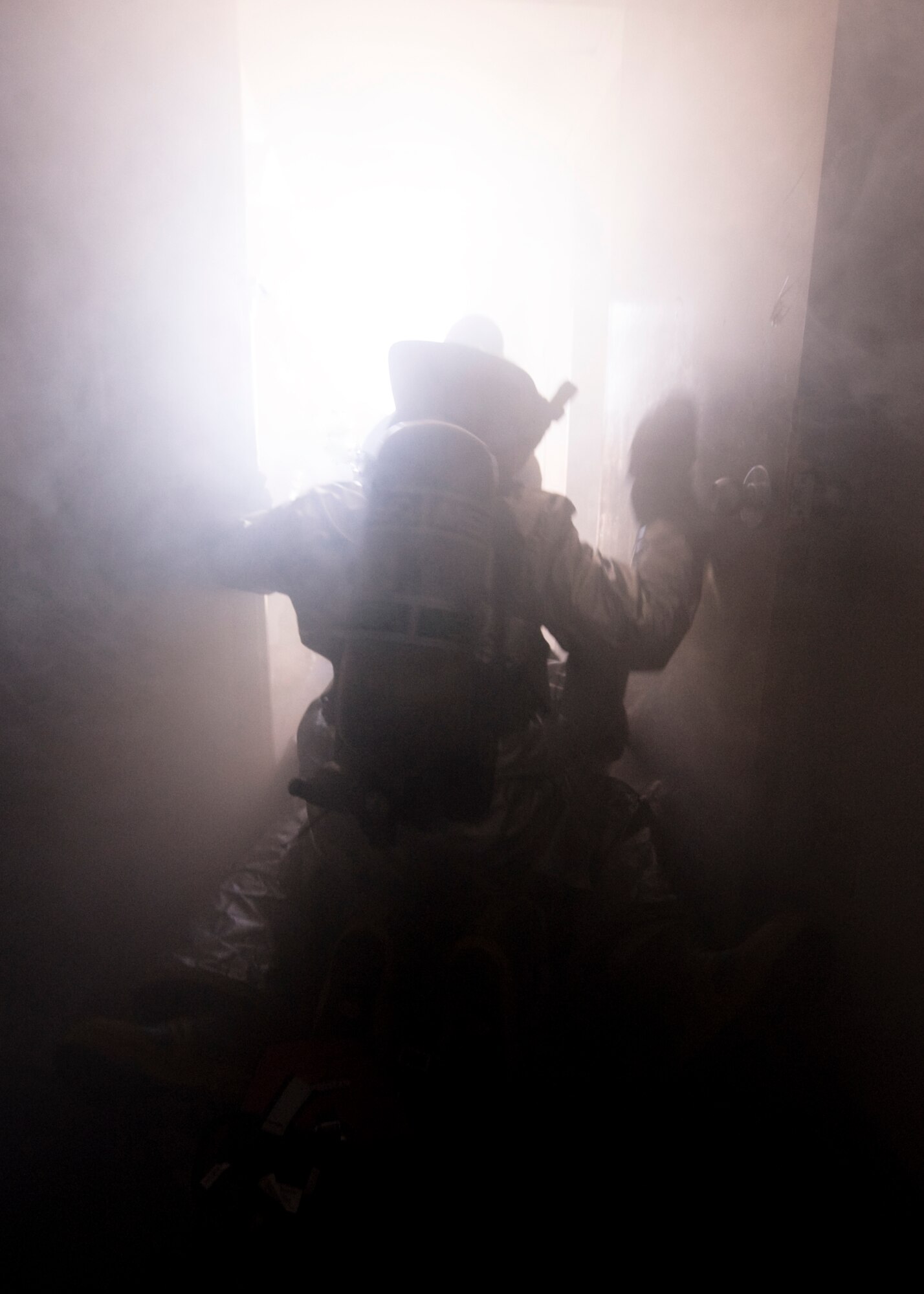 Airmen from the 7th Civil Engineer Squadron finish Rapid Intervention Team training Feb. 29, 2012, at Dyess Air Force Base, Texas. During emergencies a RIT is on stand-by in case a fellow firefighter needs evacuation. (U.S. Air Force photo by Airman 1st Class Jonathan Stefanko/ Released)