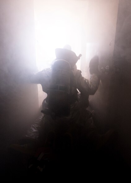 Airmen from the 7th Civil Engineer Squadron finish Rapid Intervention Team training Feb. 29, 2012, at Dyess Air Force Base, Texas. During emergencies a RIT is on stand-by in case a fellow firefighter needs evacuation. (U.S. Air Force photo by Airman 1st Class Jonathan Stefanko/ Released)