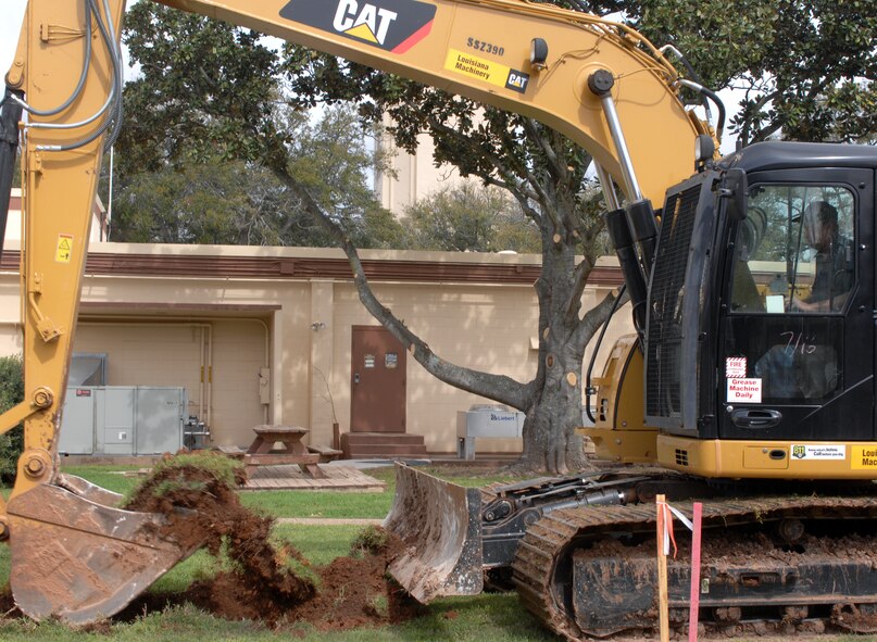 Tommy Fussell, contractor, uses an excavator to dig a hole on Barksdale Air Force Base, La., March 13. Fussell is making a hole to lay a slab of concrete that will support a Chemical Detection unit, commonly known as a smeller. (U.S. Air Force photo/Airman 1st Class Joseph A. Pagán Jr.)(RELEASED)