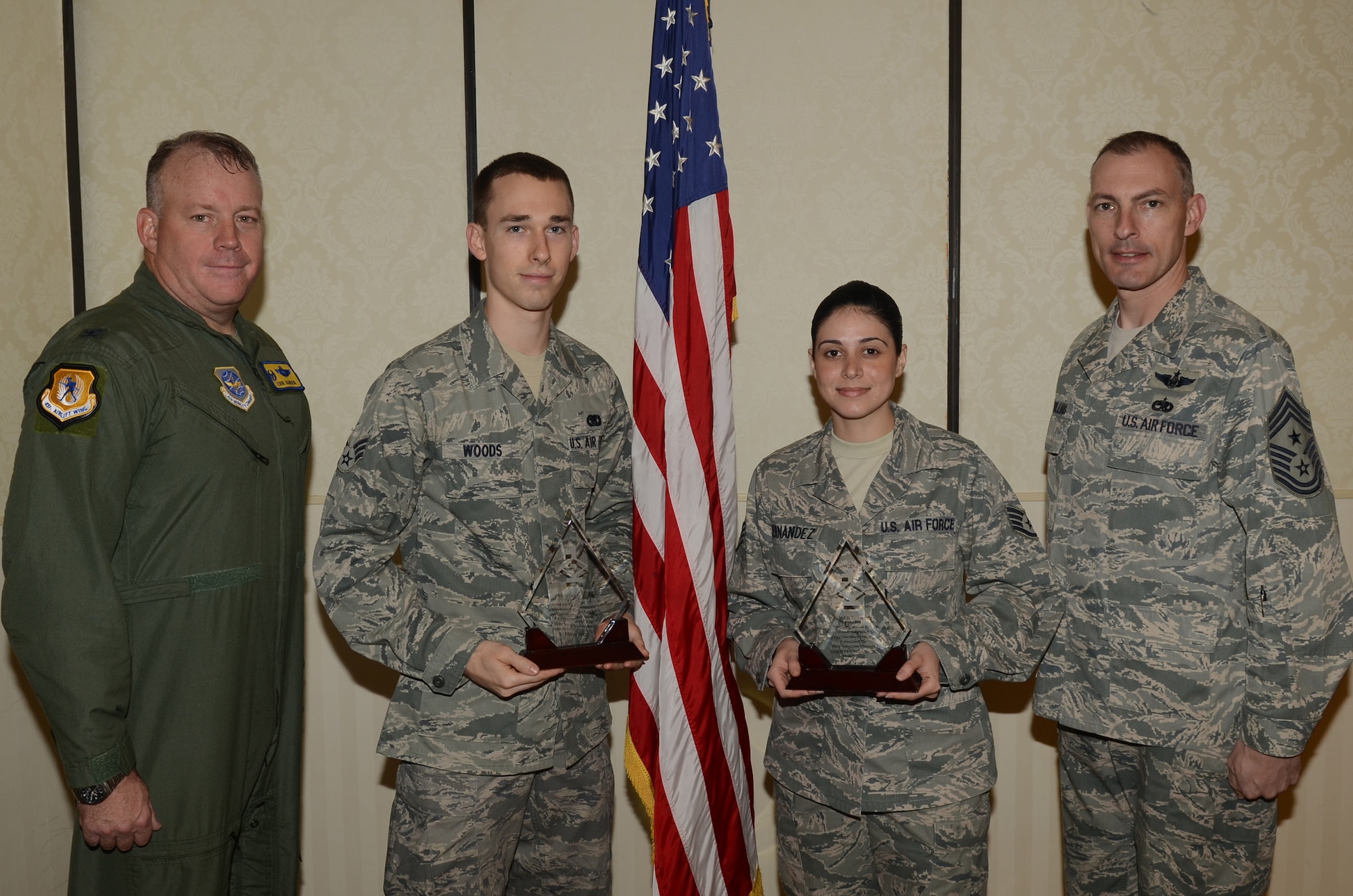 Colonel Erik Hansen and Chief Master Sgt. Larry Williams recognize the March Diamond Sharp winners at the Joint Base Charleston Club March 13. The Diamond Sharp recipients were Senior Airman Nicholas Woods, 437th Aerial Port Squadron, 437th Airlift Wing and Staff Sgt. Liz Fernandez, 437th Operations Support Squadron, 437th Airlift Wing. Diamond Sharp awardees are Airmen chosen by their first sergeants for their excellent performance. Hansen is the 437th Airlift Wing commander and Williams is the 437th AW command chief. Diamond Sharp recipients not pictured are Airman 1st Class Daniel Cherry, 14th Airlift Squadron, 437th Airlift Wing and Airman 1st Class Jonathan Akers, 16th Airlift Squadron, 437th Airlift Wing. (U.S. Air Force photo/Tech. Sgt. Chrissy Best)

