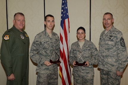 Colonel Erik Hansen and Chief Master Sgt. Larry Williams recognize the March Diamond Sharp winners at the Joint Base Charleston Club March 13. The Diamond Sharp recipients were Senior Airman Nicholas Woods, 437th Aerial Port Squadron, 437th Airlift Wing and Staff Sgt. Liz Fernandez, 437th Operations Support Squadron, 437th Airlift Wing. Diamond Sharp awardees are Airmen chosen by their first sergeants for their excellent performance. Hansen is the 437th Airlift Wing commander and Williams is the 437th AW command chief. Diamond Sharp recipients not pictured are Airman 1st Class Daniel Cherry, 14th Airlift Squadron, 437th Airlift Wing and Airman 1st Class Jonathan Akers, 16th Airlift Squadron, 437th Airlift Wing. (U.S. Air Force photo/Tech. Sgt. Chrissy Best)
