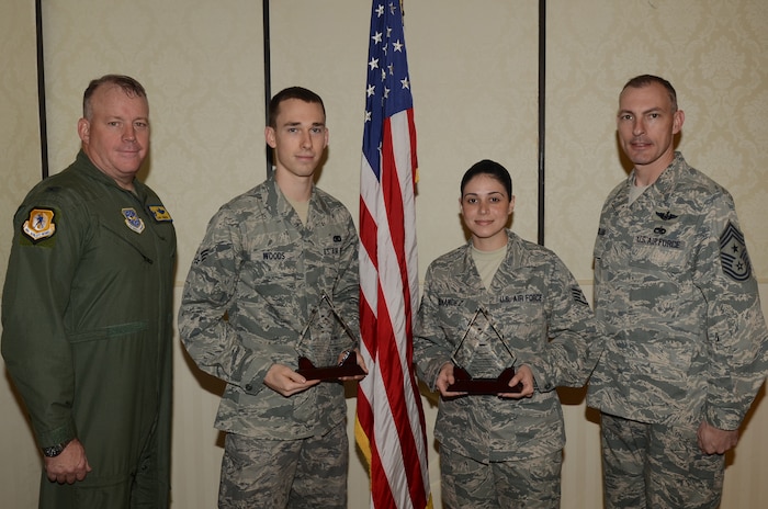 Colonel Erik Hansen and Chief Master Sgt. Larry Williams recognize the March Diamond Sharp winners at the Joint Base Charleston Club March 13. The Diamond Sharp recipients were Senior Airman Nicholas Woods, 437th Aerial Port Squadron, 437th Airlift Wing and Staff Sgt. Liz Fernandez, 437th Operations Support Squadron, 437th Airlift Wing. Diamond Sharp awardees are Airmen chosen by their first sergeants for their excellent performance. Hansen is the 437th Airlift Wing commander and Williams is the 437th AW command chief. Diamond Sharp recipients not pictured are Airman 1st Class Daniel Cherry, 14th Airlift Squadron, 437th Airlift Wing and Airman 1st Class Jonathan Akers, 16th Airlift Squadron, 437th Airlift Wing. (U.S. Air Force photo/Tech. Sgt. Chrissy Best)
