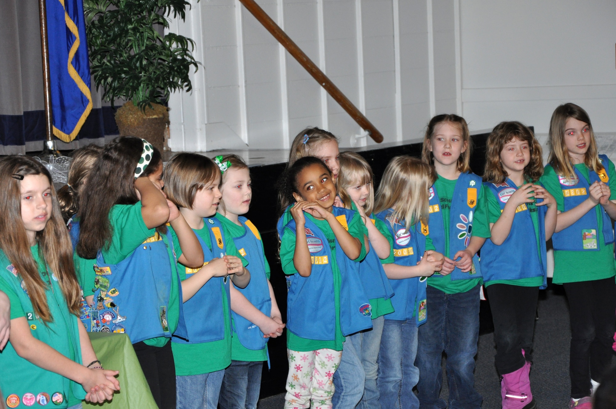 Girl Scouts from Grand Forks Air Force Base, N.D., perform the Girl Scouts of the United States of America song on base March 12, 2012. The song presentation was part of a ceremony to recognize the 100th anniversary of the Girl Scout organization. (U.S. Air Force photo/Airman 1st Class Derek VanHorn)