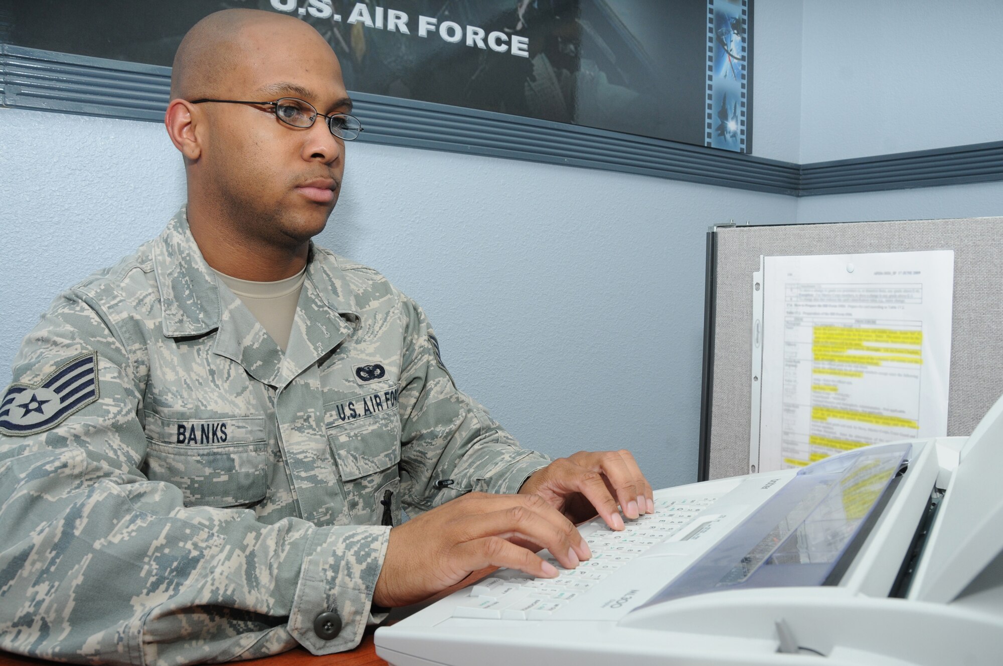 Staff Sgt. Angelo Banks, 81st Security Forces Squadron, creates a Geneva Convention card for a customer March 8, 2012, at the visitor control center, Keesler Air Force Base, Miss.  Banks is the Air Education and Training Command’s Airman of the Year for 2011.  (U.S. Air Force photo by Kemberly Groue)