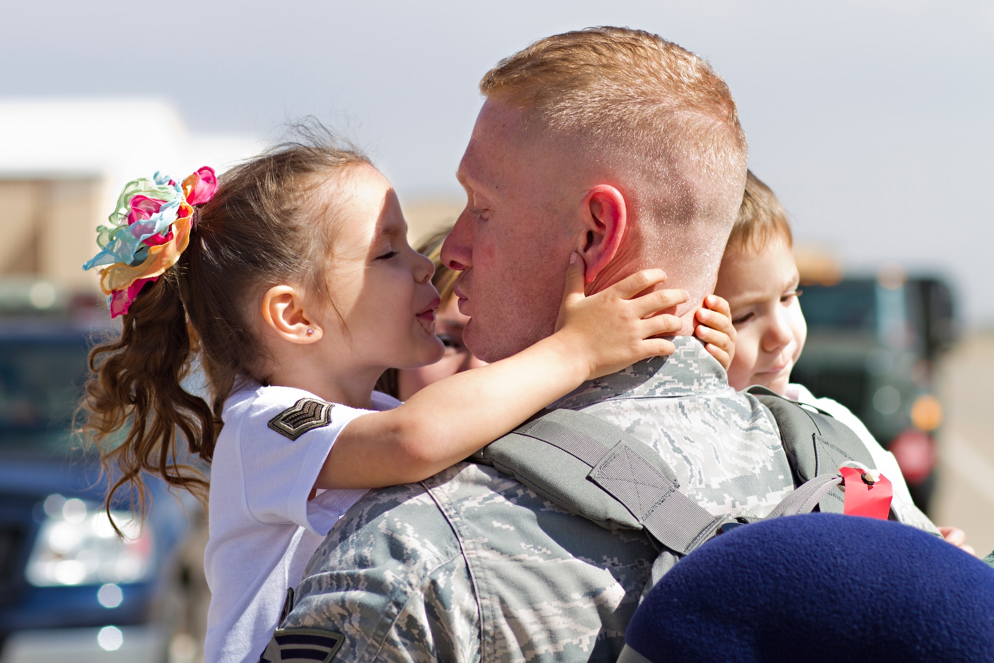 Staff Sgt. Clayton Loper, 27th Special Operations Aircraft Maintenance Squadron, greets his family during Operation Homecoming on the Cannon Air Force Base, N.M., flightline March 7. Operation Homecoming is a monthly event held to welcome Air Commandos back from worldwide deployments and reunite them with family and friends.  (U.S. Air Force photo by 1st Lt. Stephanie Schonberger)