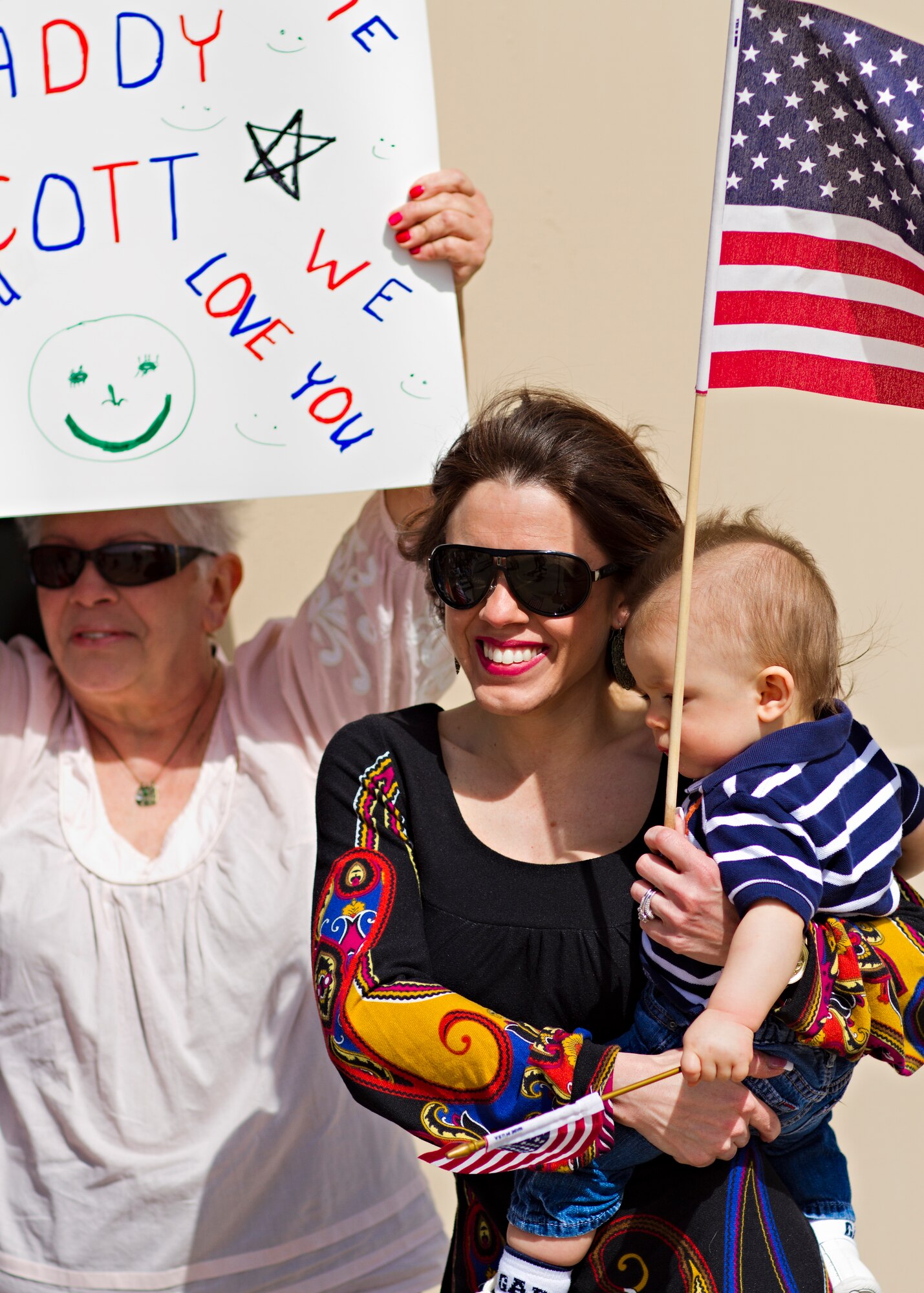 Family members await their loved ones' arrival for Operation Homecoming on the Cannon Air Force Base, N.M., flightline March 7.  Operation Homecoming is a monthly event held to welcome Air Commandos back from worldwide deployments and reunite them with family and friends.  (U.S. Air Force photo by 1st Lt. Stephanie Schonberger)
