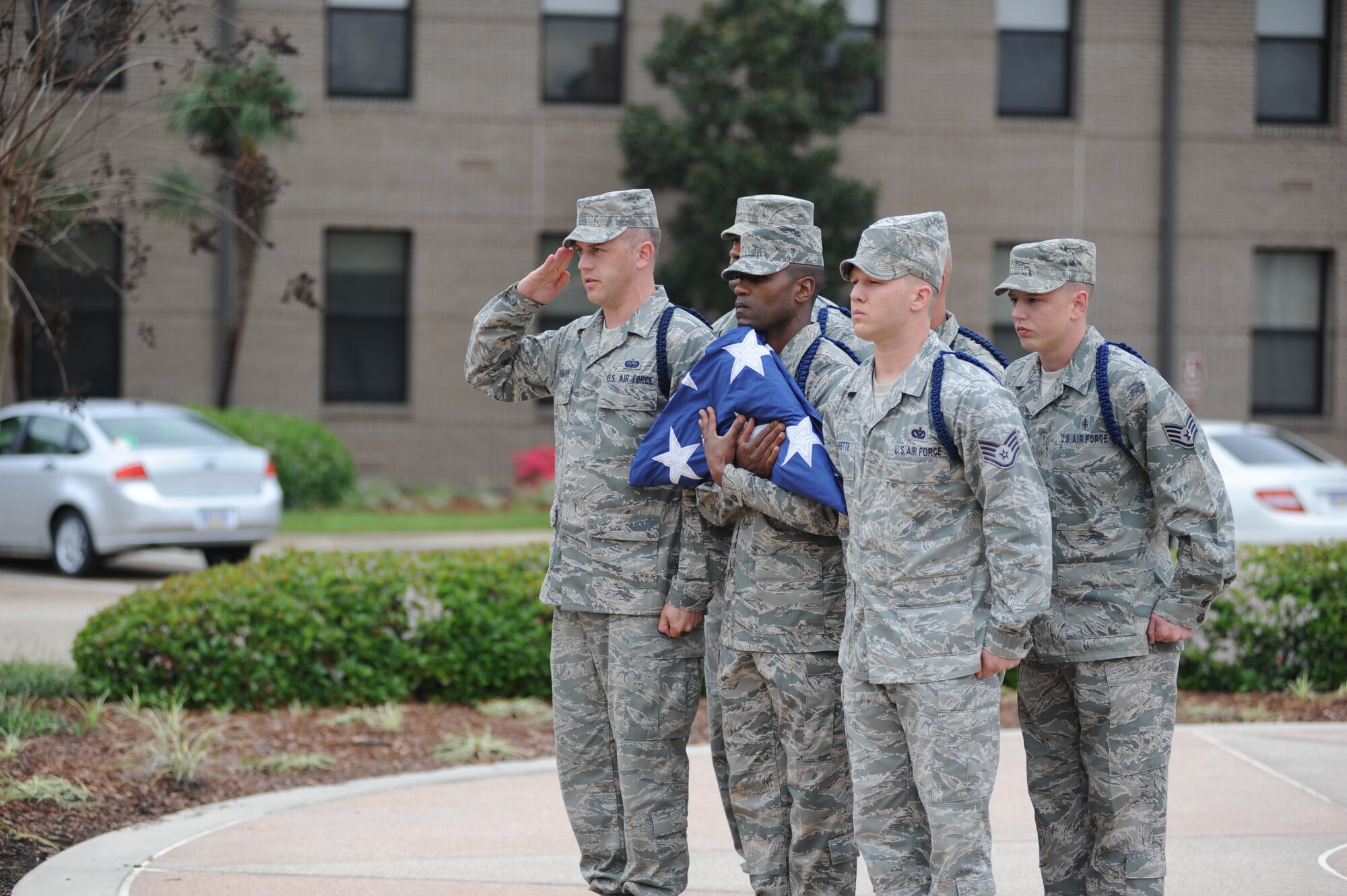 Military Training Leaders serve as the flag security detail and retire the colors during the 81st Training Wing retreat ceremony March 9, 2012, Keesler Air Force Base, Miss.  (U.S. Air Force photo by Kemberly Groue)