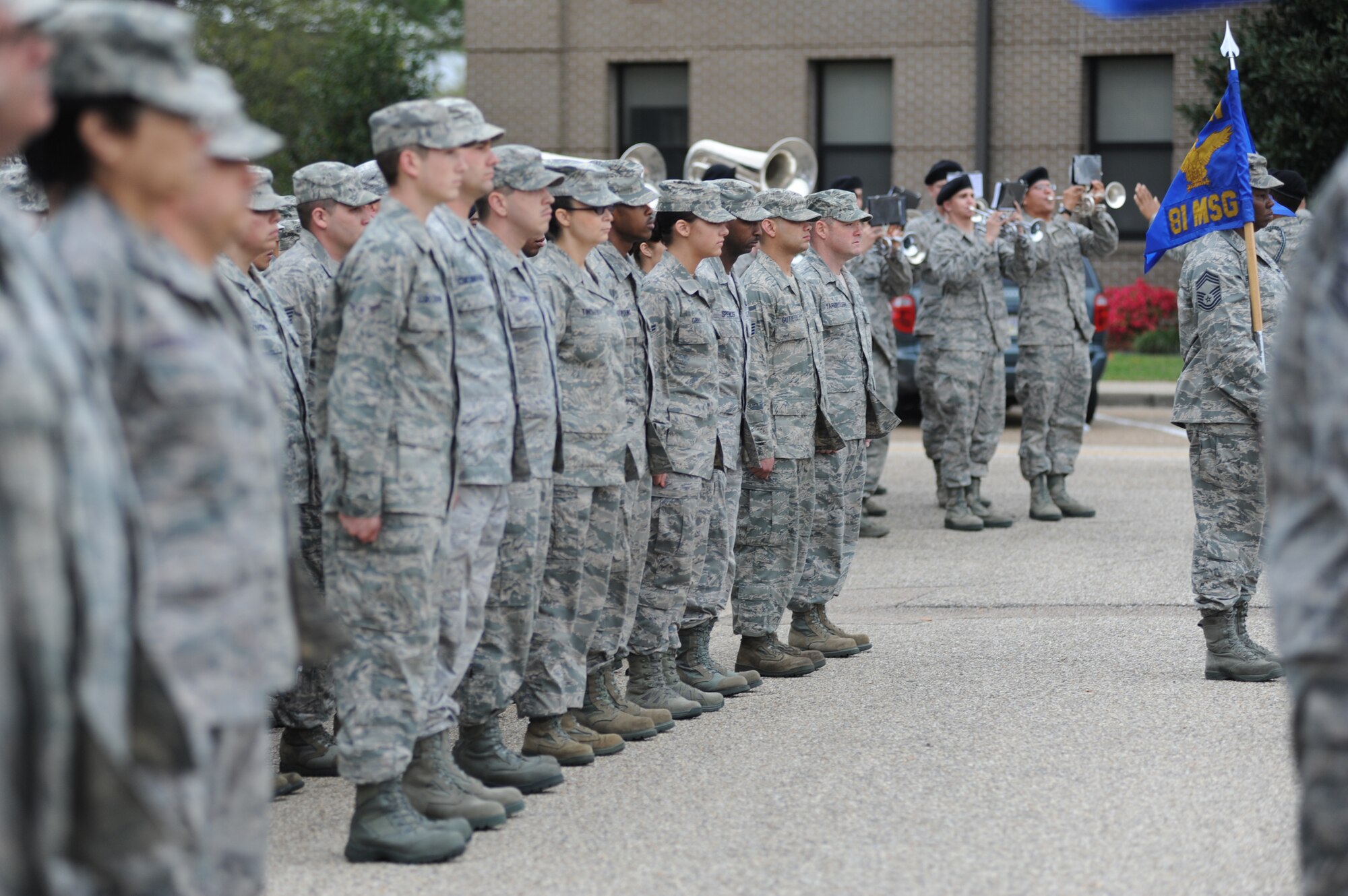 Keesler’s Drum and Bugle Corps plays the national Anthem while flights from 81st Mission Support Group, 81st Training Group, and 81st Medical Group, stand at attention during a retreat ceremony March 9, 2012, Keesler Air Force Base, Miss.  (U.S. Air Force photo by Kemberly Groue)