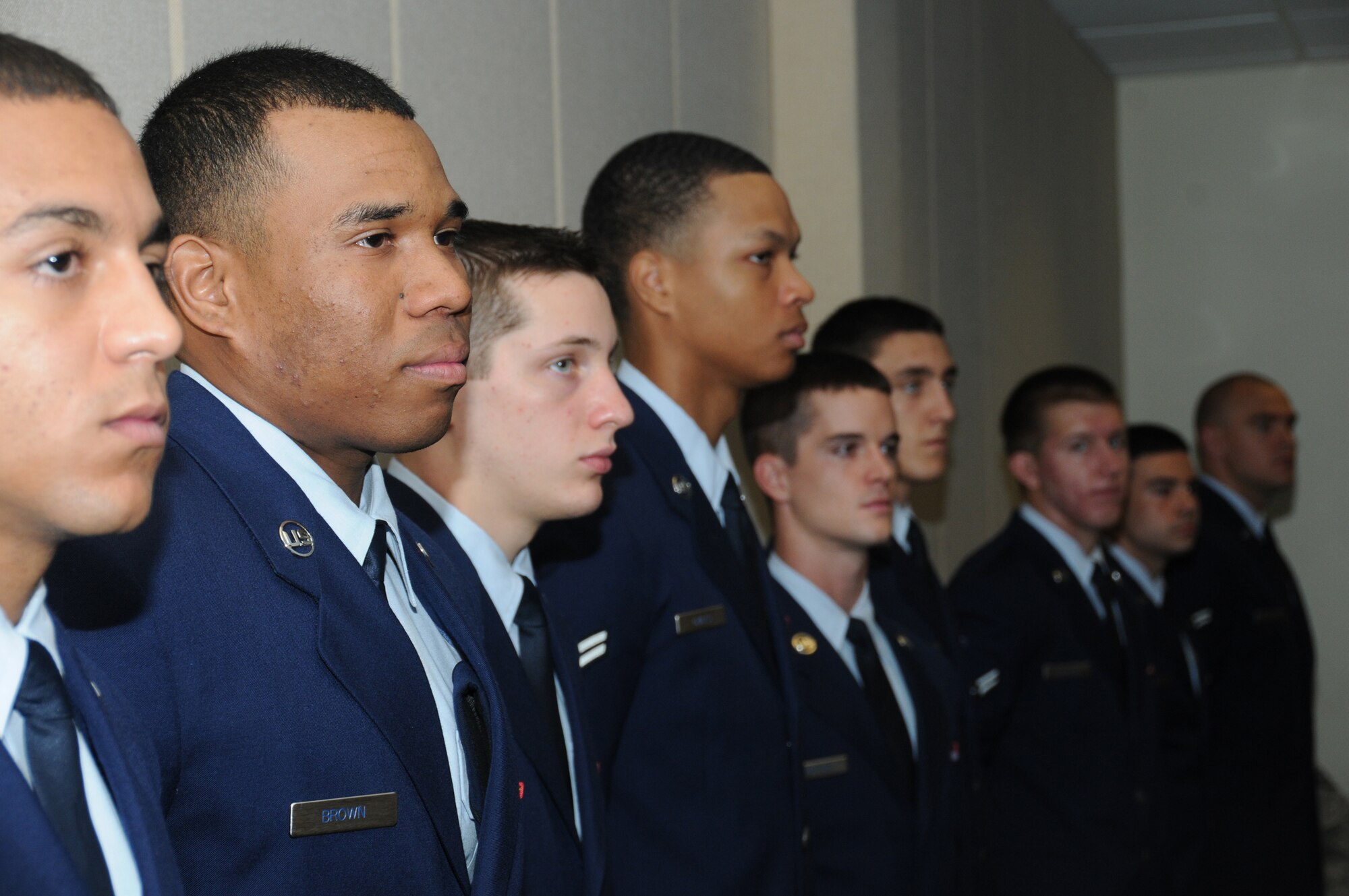 Airman 1st Class Christopher Brown, 334th Training Squadron, prepares for graduation from the air traffic control apprentice course March 7, 2012, at Cody Hall, Keesler Air Force Base, Miss.  Airman Brown’s brother, Tech. Sgt. Ronald Brown Jr., 334th TRS instructor supervisor, served as the master of ceremonies, and their father, Ronald Brown, retired U.S. Air Force major from Arizona, also attended the graduation.  (U.S. Air Force photo by Kemberly Groue)